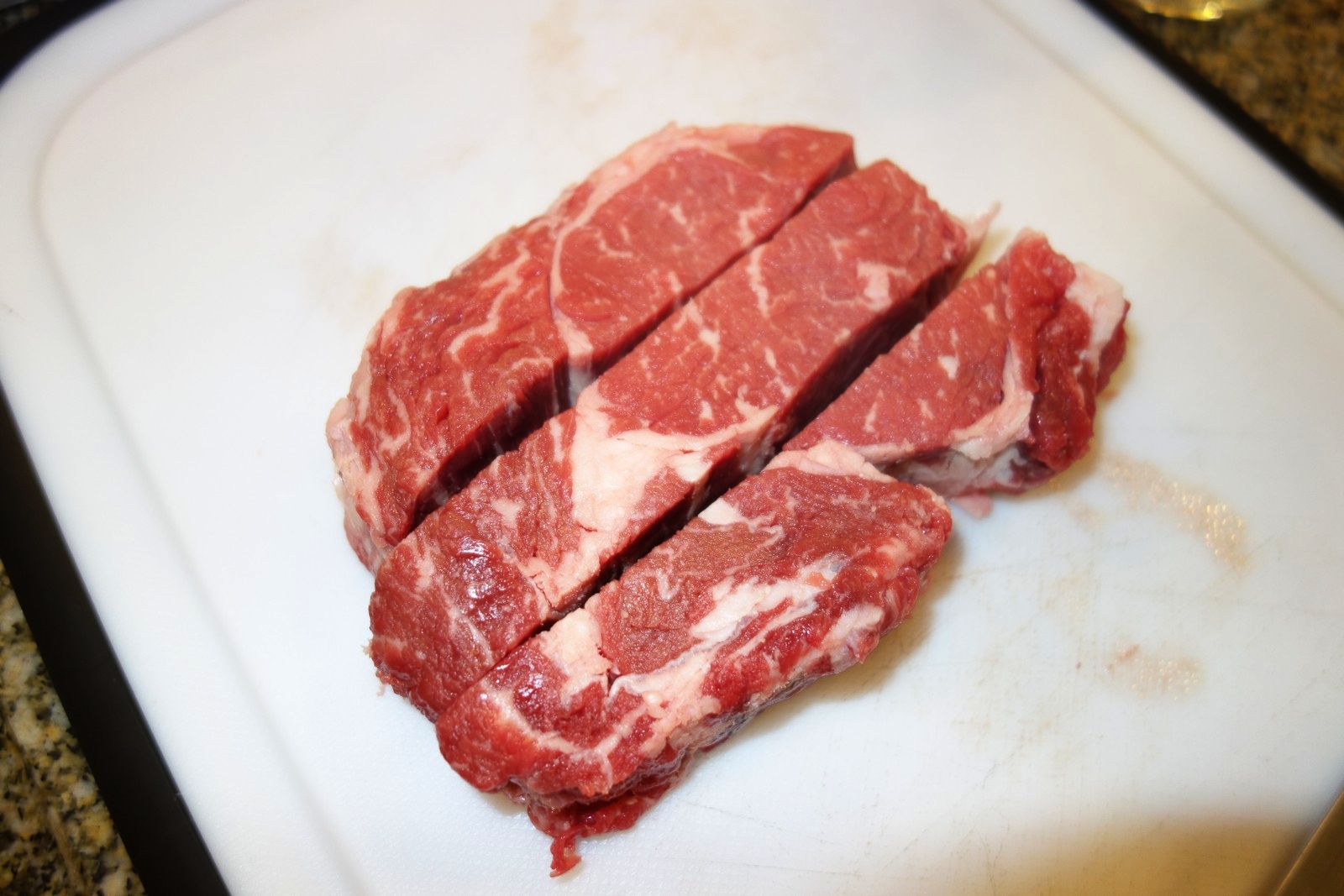 A typical ribeye is about 1 pound. Trim away excess fat, then slice it lengthwise, then crosswise to cube it.