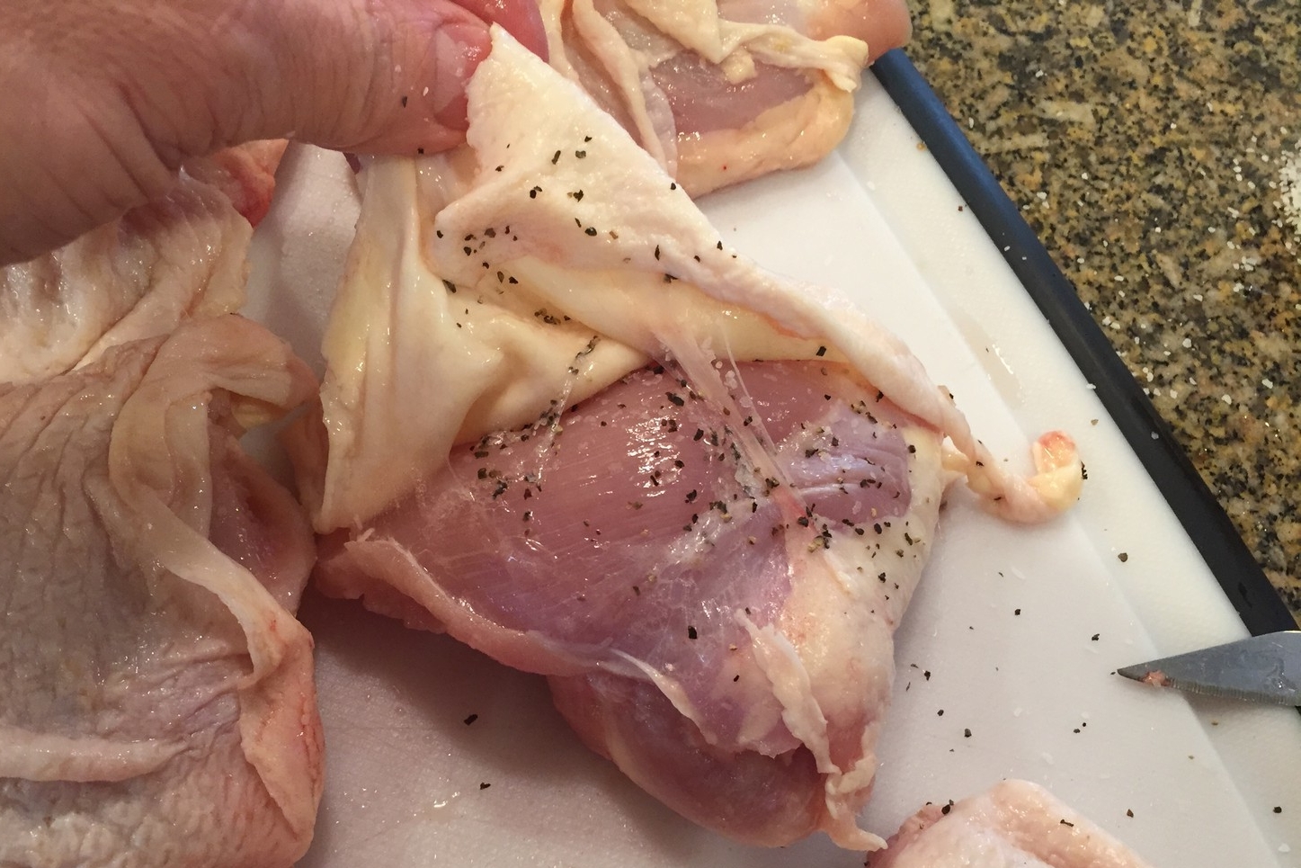 Peel the skin back from the meaty side so you can put seasoning directly on the meat. Particularly important if you are not planning to eat the skin.