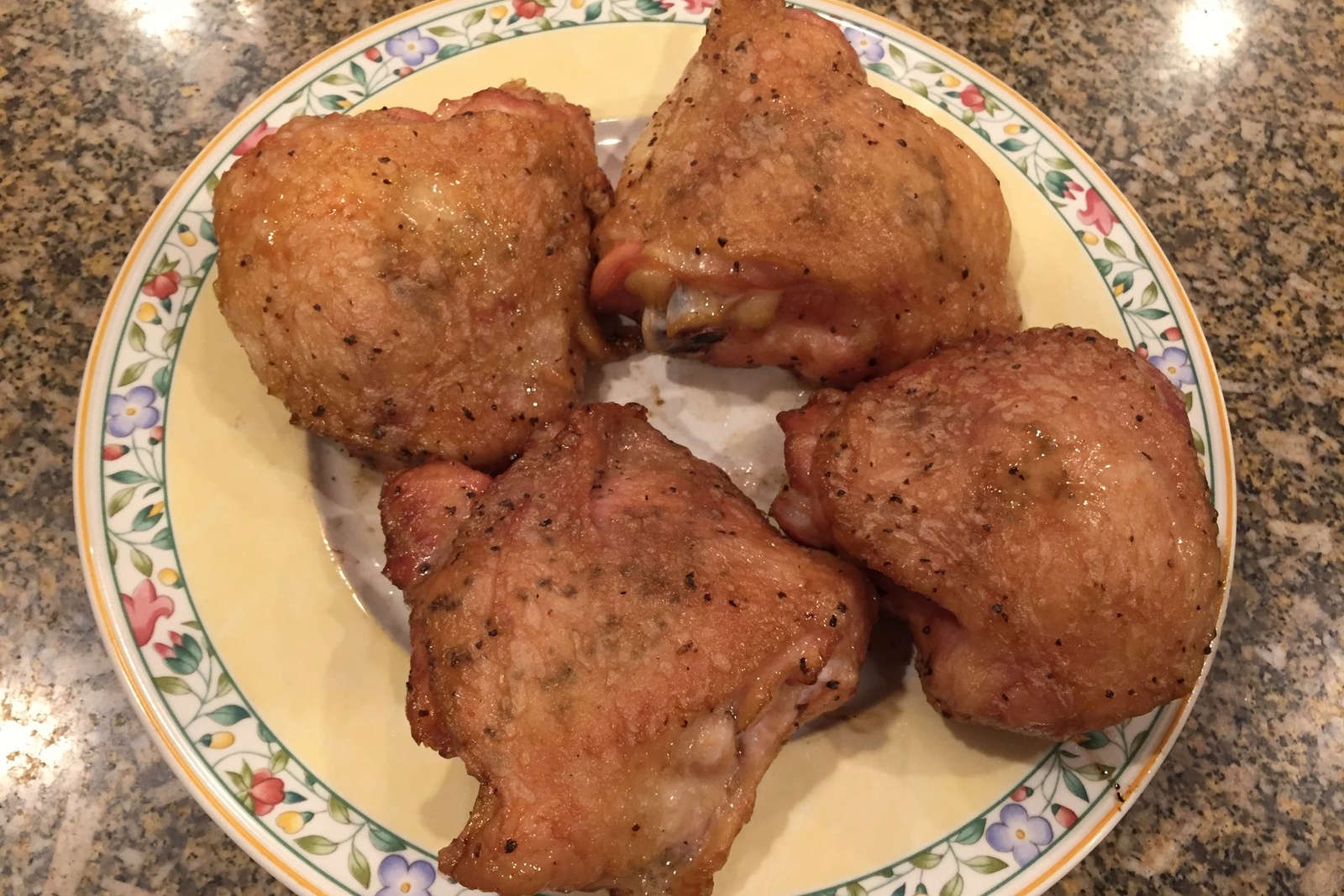 Here are some plain chicken thighs that have been seasoned with salt and pepper. What you can't see is the delicious smokey aroma, or how tender and juicy they are underneath the crispy brown skin. 