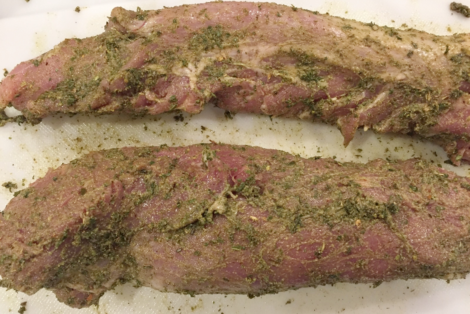 Apply the rub liberally to both halves of the tenderloin.