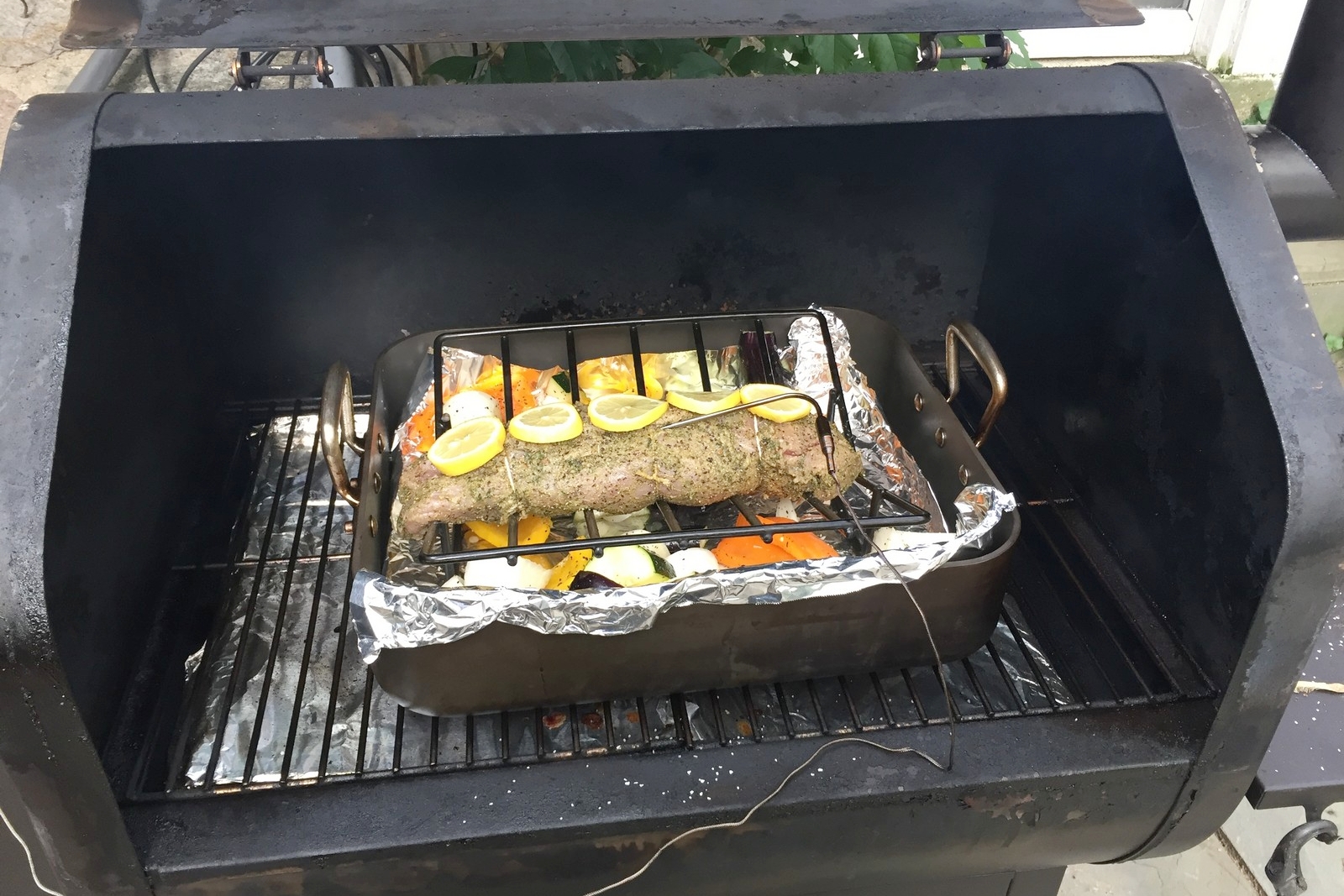 Place in the oven or smoker (shown here) at 375. Insert a probe so you can monitor the temperature without having to open the lid or oven door, which can slow down your cook.