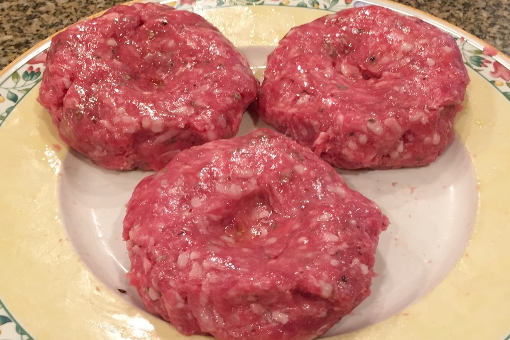 Make the burgers flat, with a dimple in the middle.