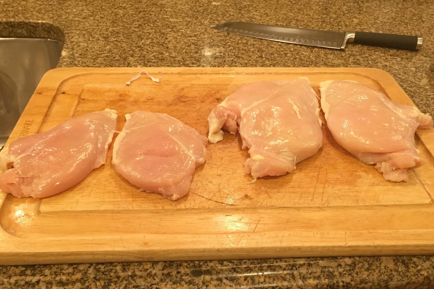 Four breast halves (Amish on the left), ready for brining.