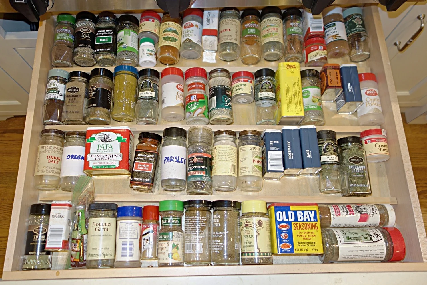 Spices in the Top 3 rows are arranged alphabetically, so you can find them in a snap. Miscellaneous mixed spices fill the remaining space at the bottom. Simple wood strips were cut and simply put in place (not nailed or glued) as dividers.