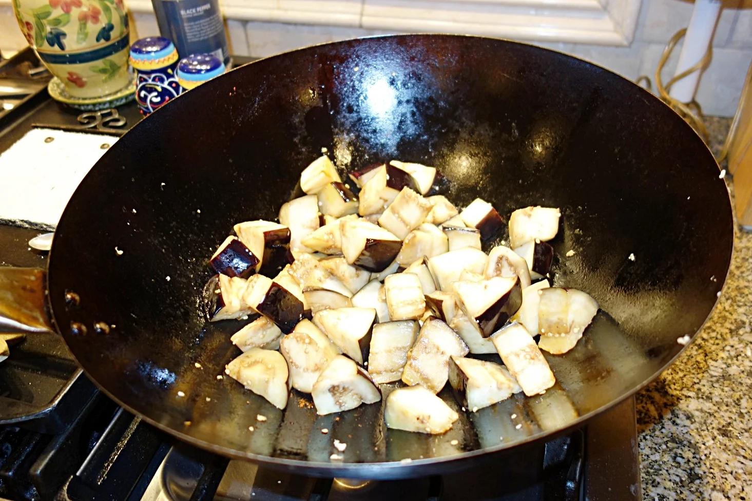 Stir-fry or saute the eggplant in oil, flipping it frequently.