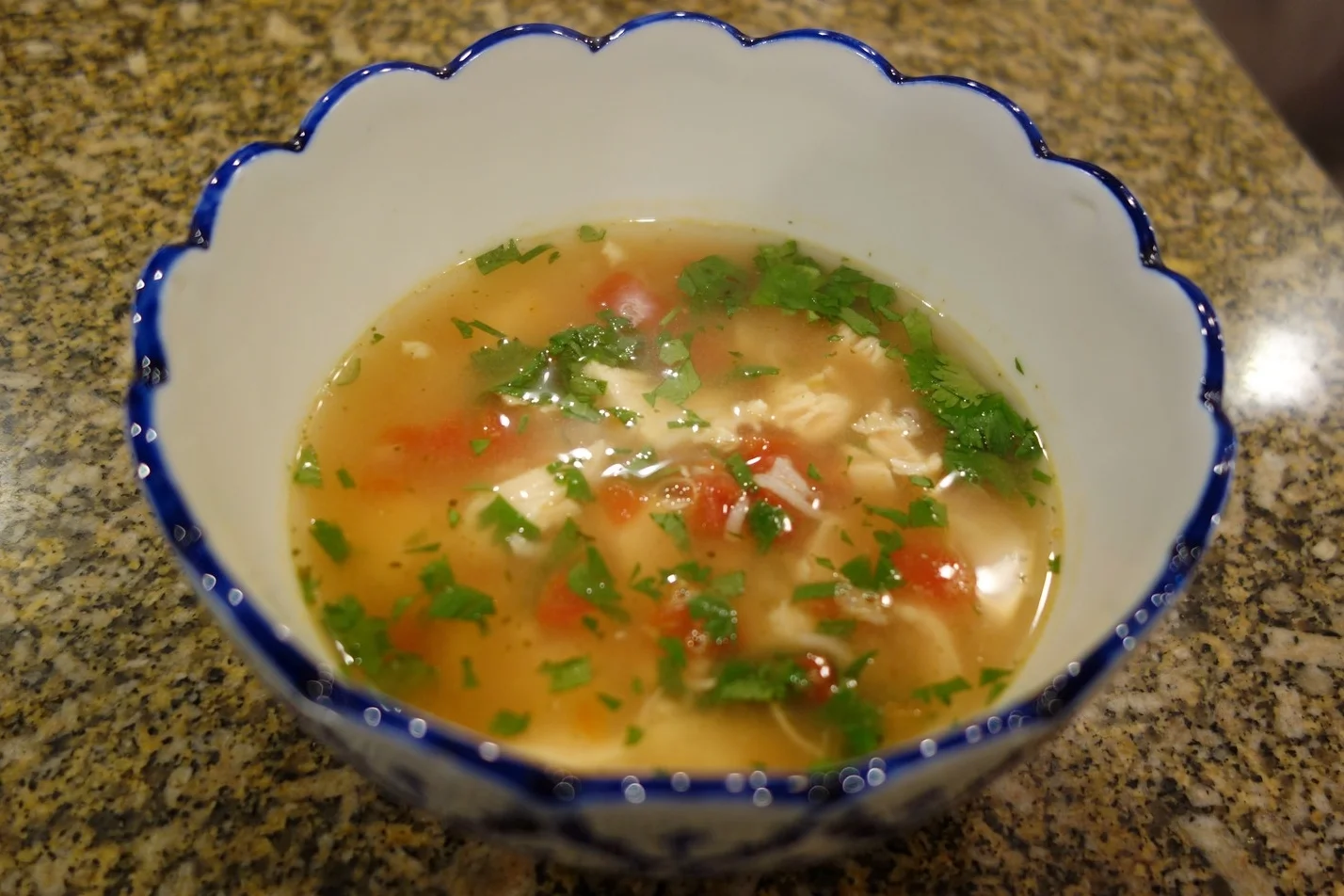 Cilantro added, ready for avocado. With chicken, rice, and tomatoes, This is a hearty soup!