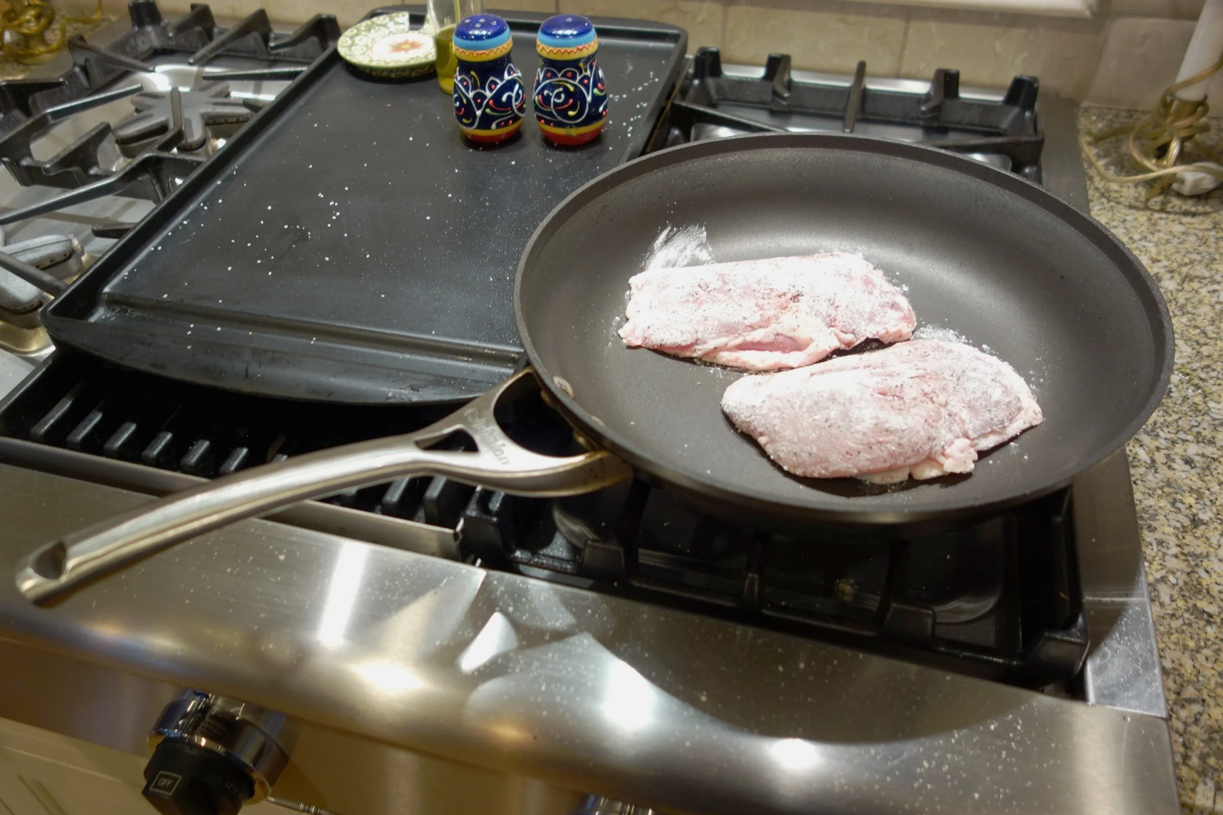 Place breasts fat-side down on a non-heated skillet that is oven-safe (metal handles, no plastic).