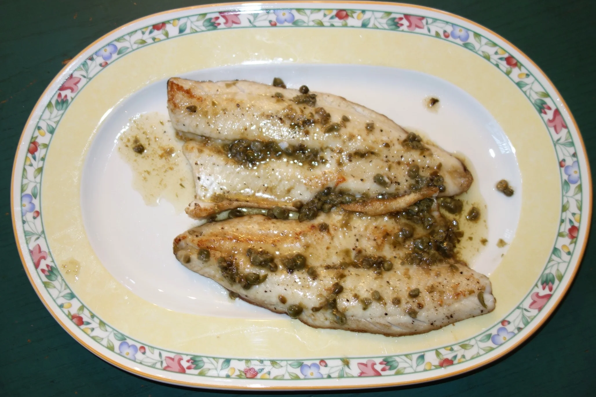 Pour the sauce bowl into the remaining brown butter and drippings. Stir on medium heat until all brown.Move the fish to a serving platter, then pour the sauce over the fish and serve.