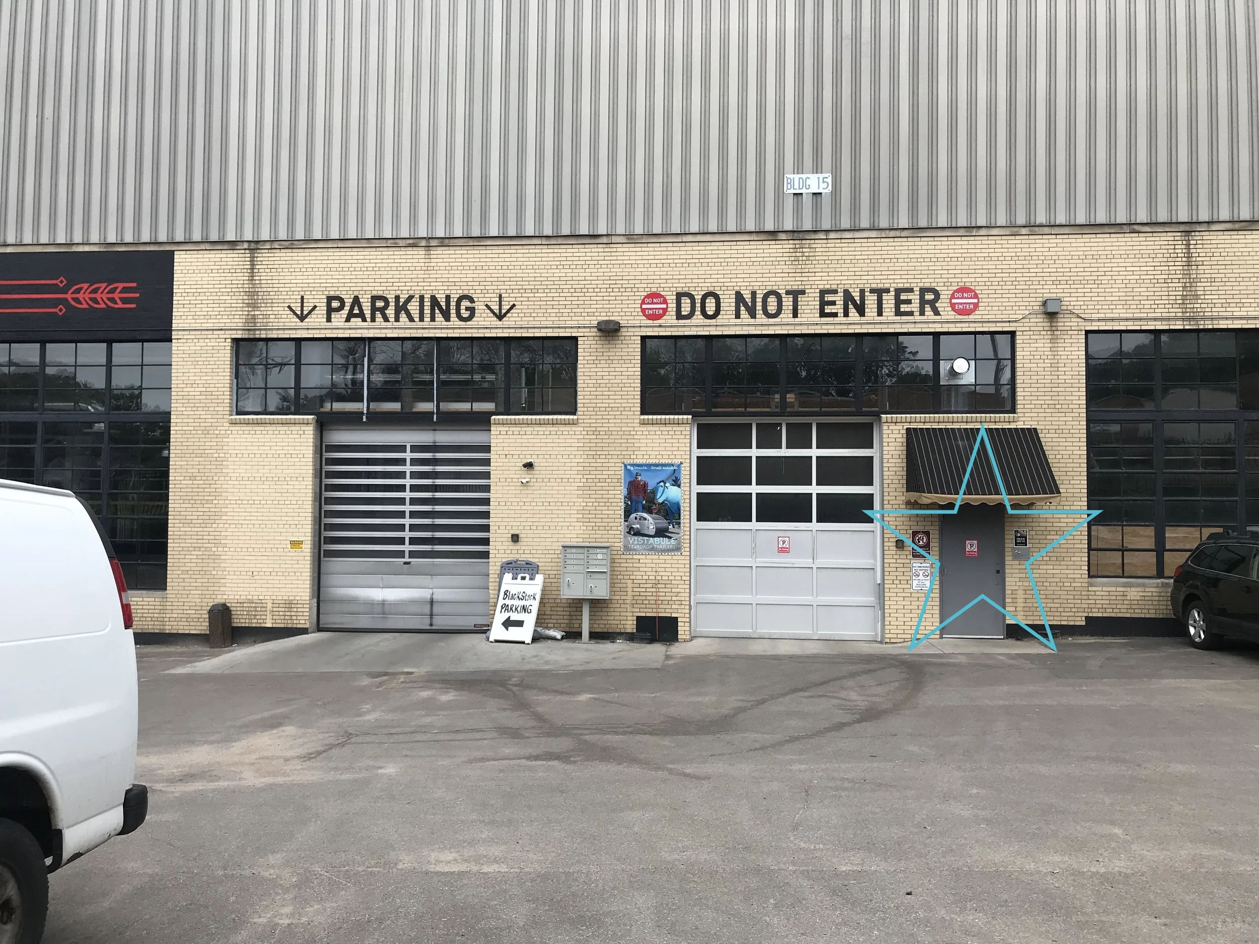 If you are driving to us, look for these doors! The blue star is where you should enter the building. Just north of Blackstack Brewery.You’ll see a green water tower and a large smoke stack from about a block away! Follow the smoke stack! You’ll wan…