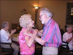 Residents dance to the piano tunes at Happy Hour, a weekly affair.
