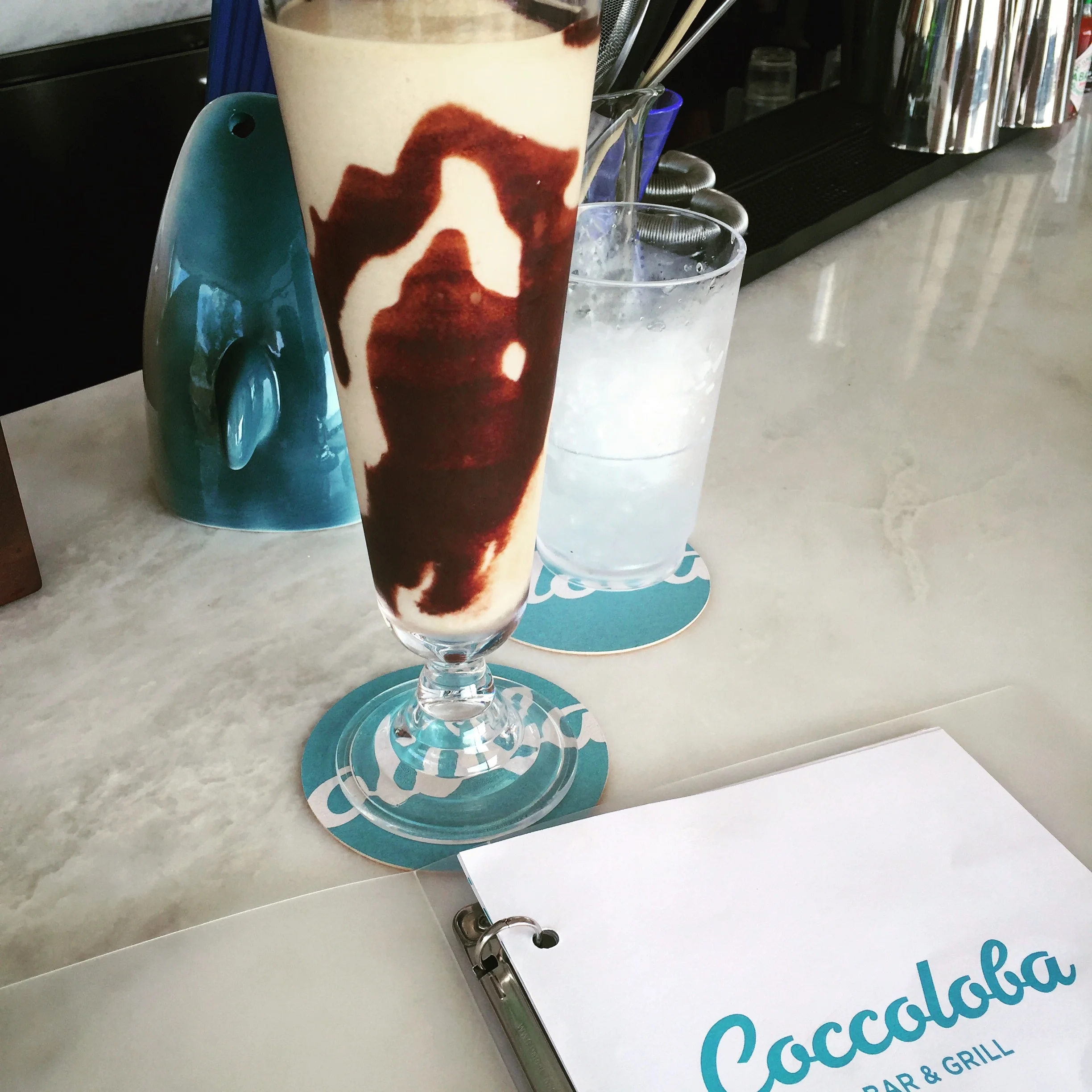 Coccoslide: absolut, crème de cacao, coconut, house cold brew coffee & cream