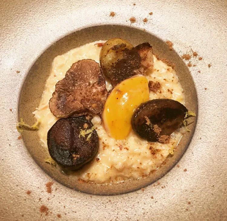 Potatoes with brown crab meat, cured egg yolk, porcini and truffles