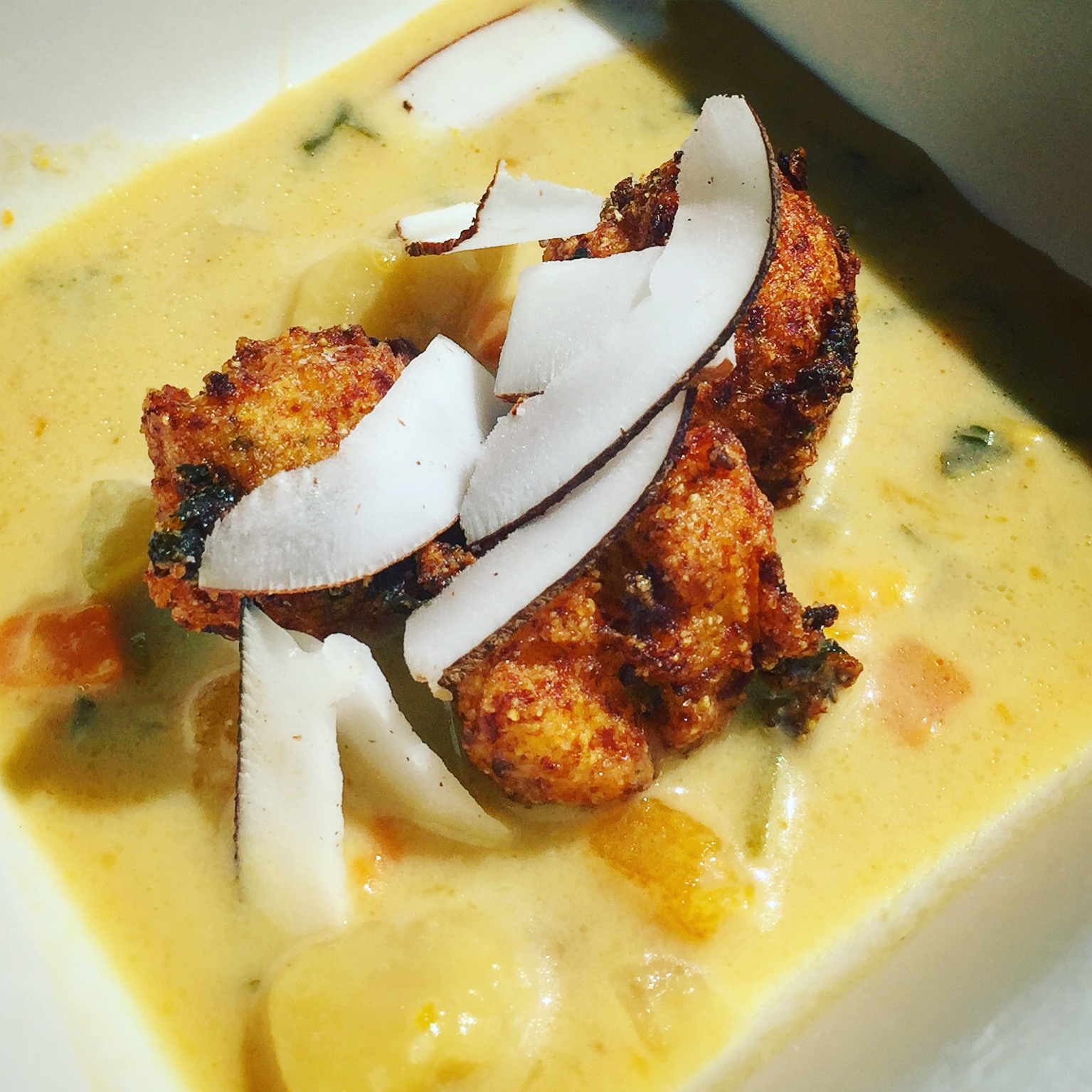 The Brasserie's take on North Side fish tea topped with lionfish hush puppies