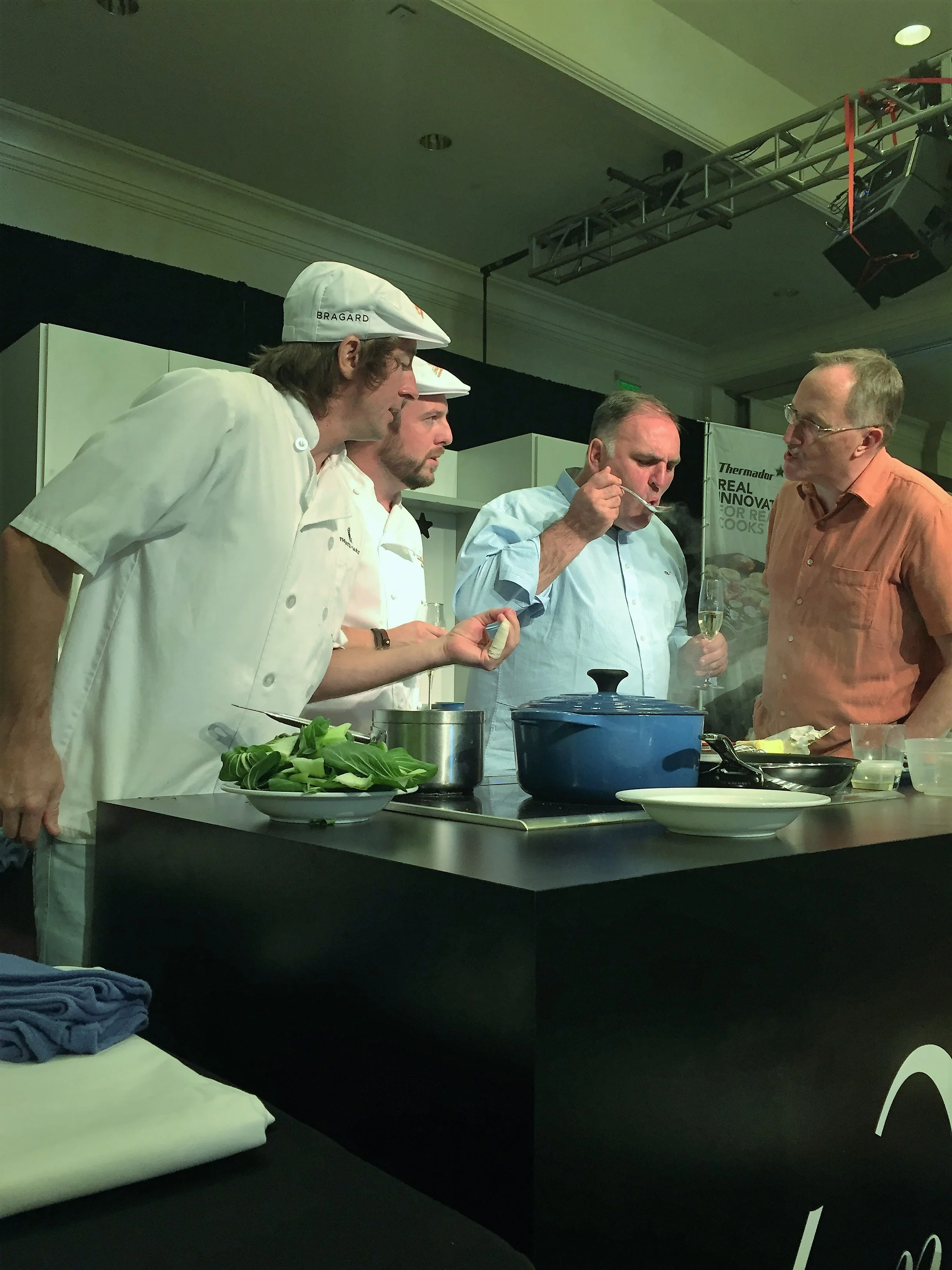Chef José Andrés tasting amateur chef Neville Hicks' dish