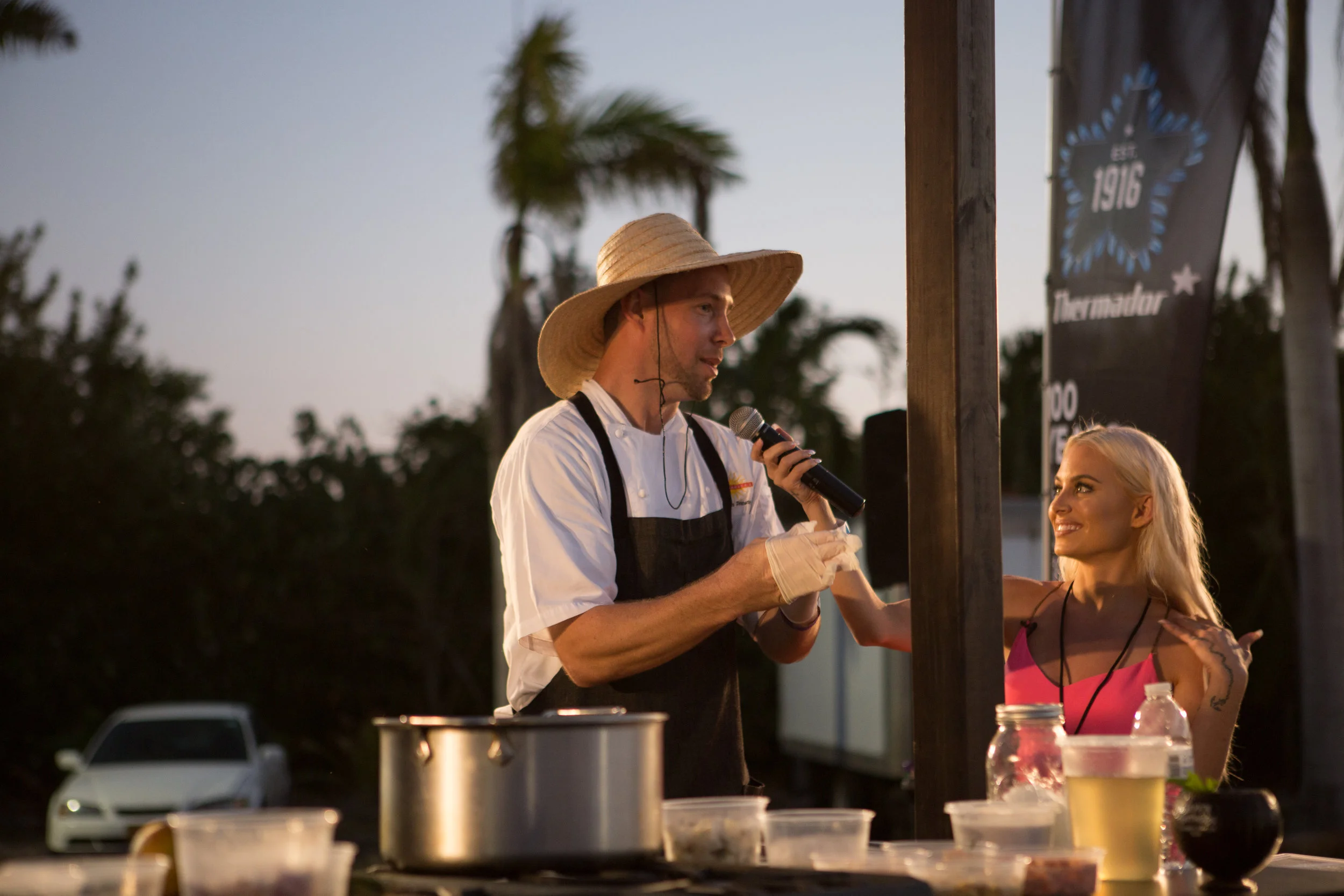 Courtney getting the scoop on lionfish & me apparently from Chef Thomas of The Brasserie Photo credit: Chad Munro of Picture This Studios