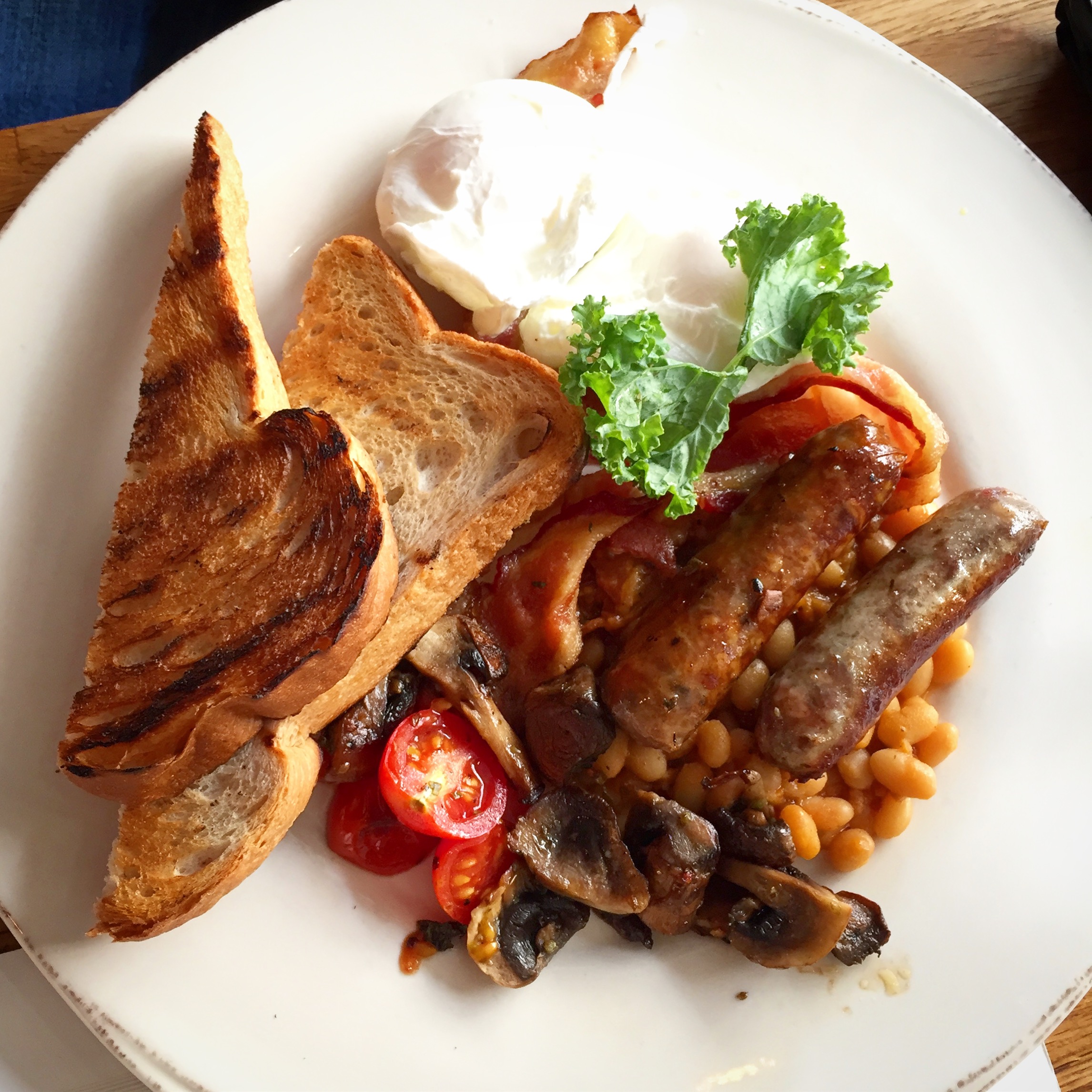 I am a huge fan of a classic English fry-up so I was pleased to see that The Great Brit was on the menu. A plate loaded with 2 poached eggs, applewood smoked bacon, grilled sausage, stewed tomatoes, sautéed mushrooms, homemade baked beans and toast. Note that technically you can have your eggs anyway that you want.