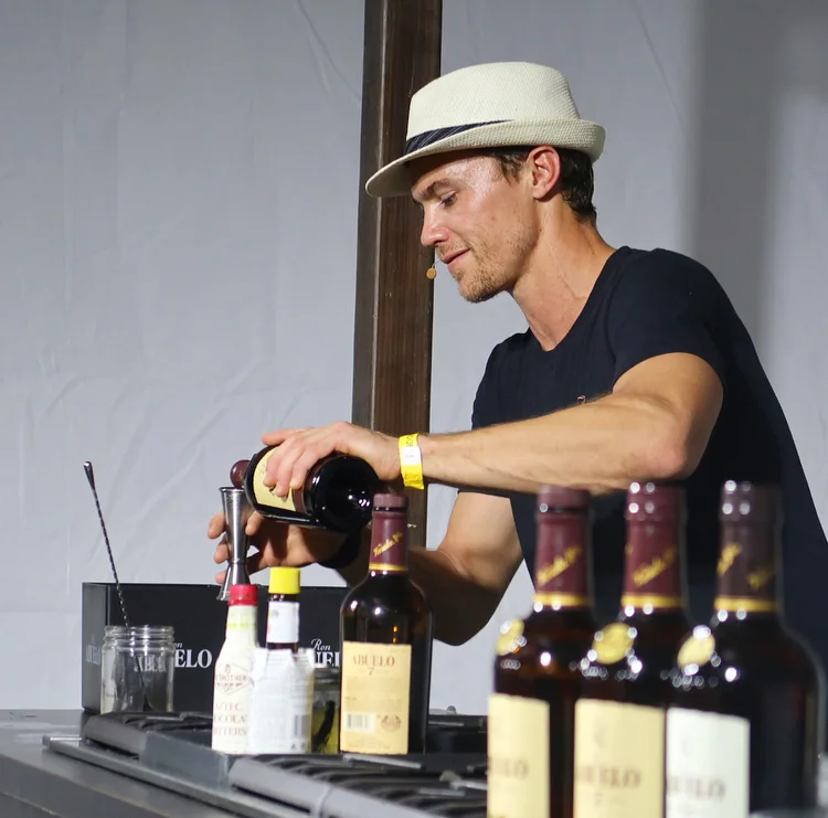 Cory Scruggs of Sunshine Grill, teaching the Experience Room audience about Abuelo rum