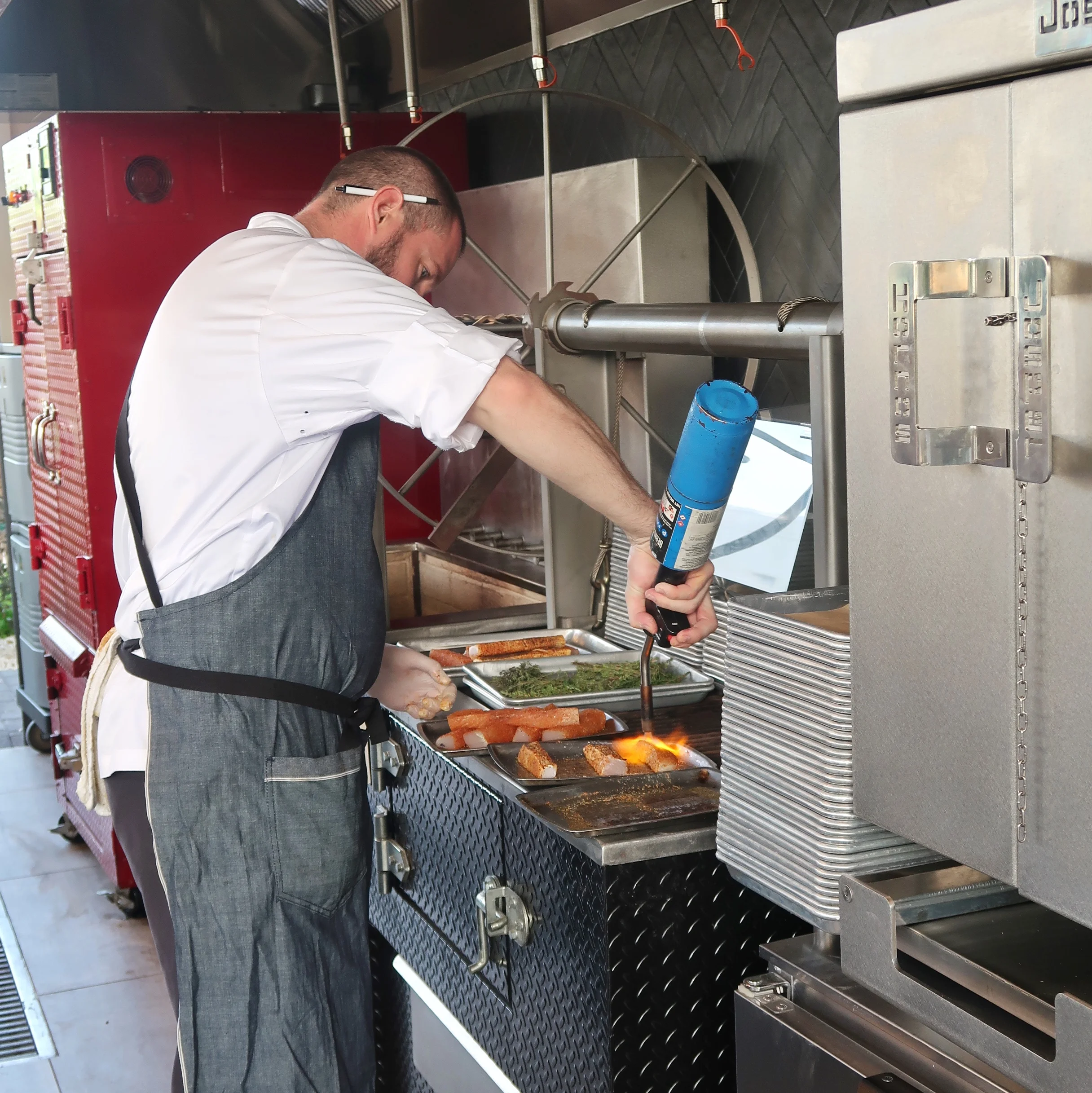 Chef Thomas Tennant torching his wahoo