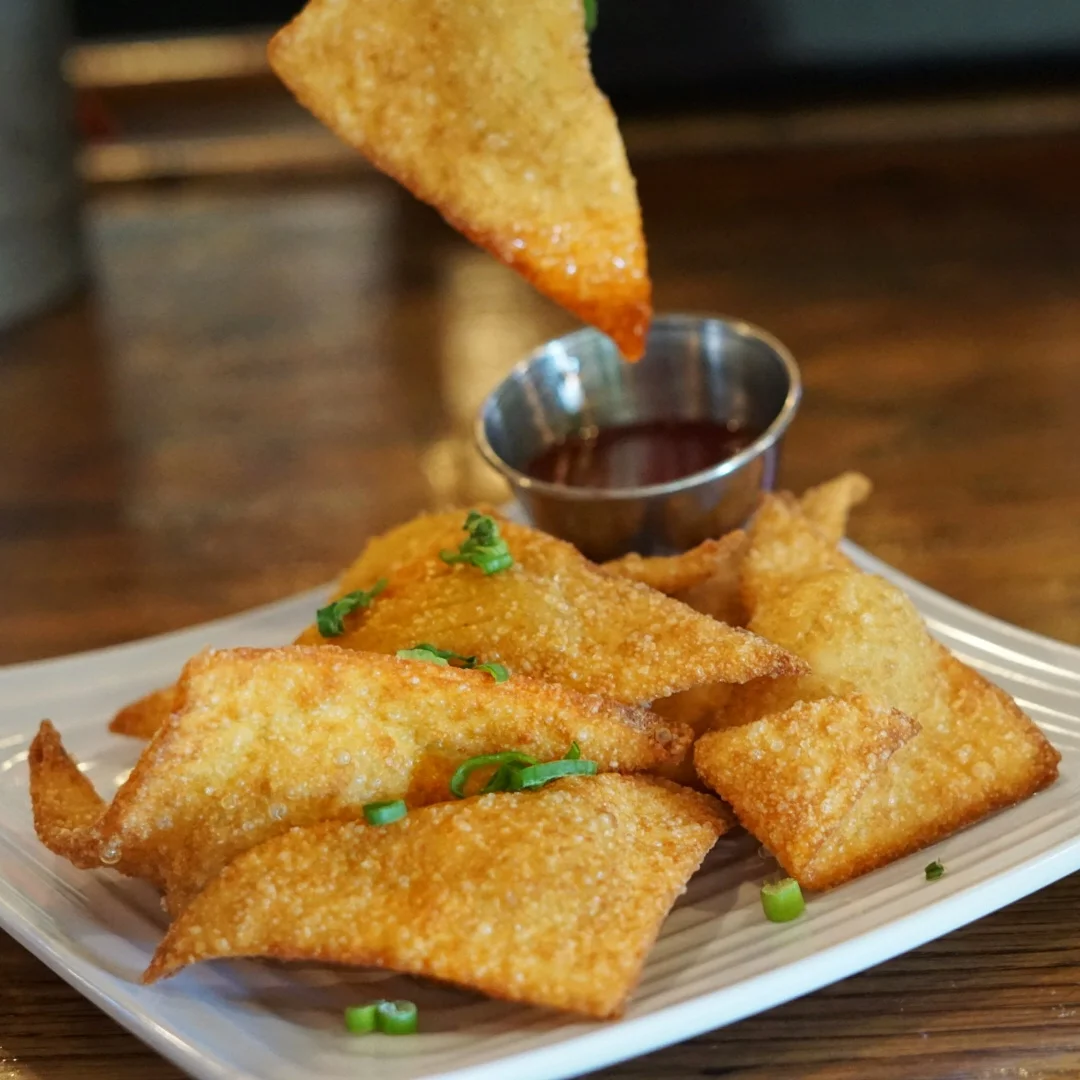 The Crispy Crab Wontons are a great appetiser to share (or not). They are stuffed with blue sea crab and cream cheese and a side of sweet and sour sauce.