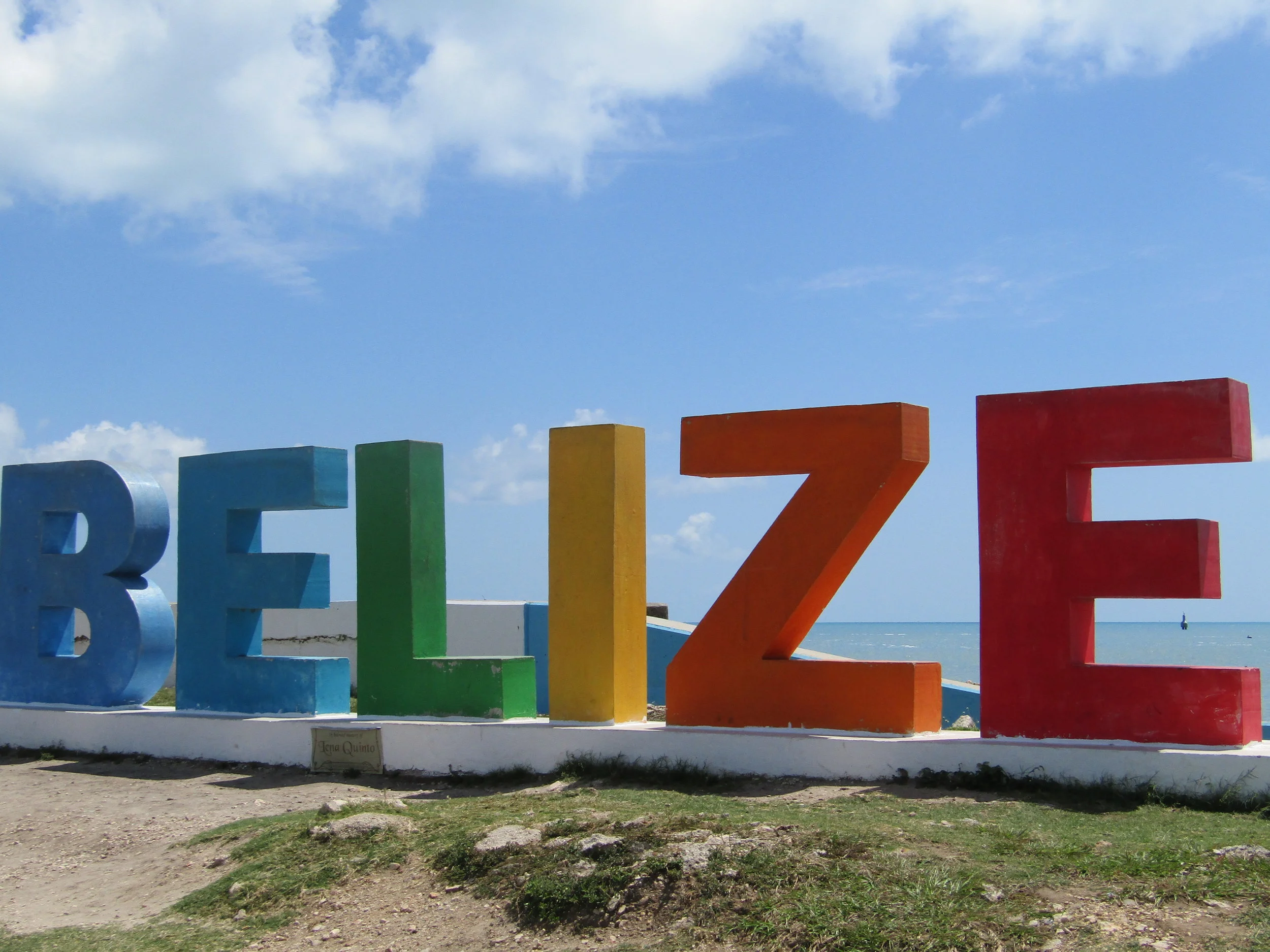 Belize sign on the shore in Belize City.