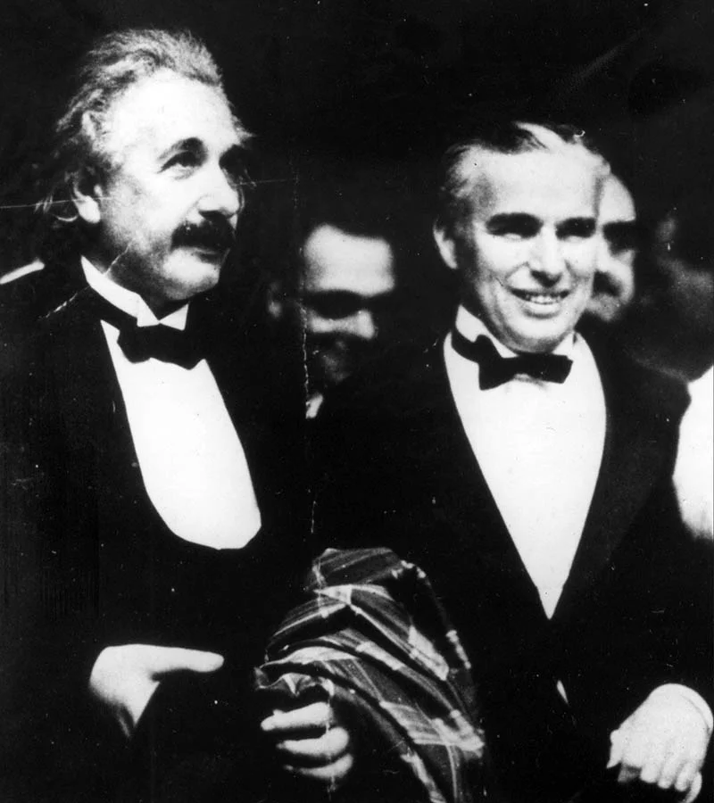 Albert Einstein joins Charlie Chaplin at the Los Angeles Theater in 1931 for the premiere of Chaplin’s movie City Lights.