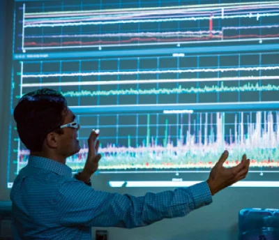 LIGO senior scientist Koji Arai explains the trends showing the variations in noise over a period of eight hours at Caltech’s 40-meter prototype interferometer. The change from quiet to noisy in the bottom panel is due to ground motion caused by loc…