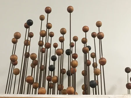 A faded model of γ-brass, an alloy of copper and zinc (Cu5Zn8). There are four types of brass balls: 20 Cu (red and orange) and 32 Zn (green and black).