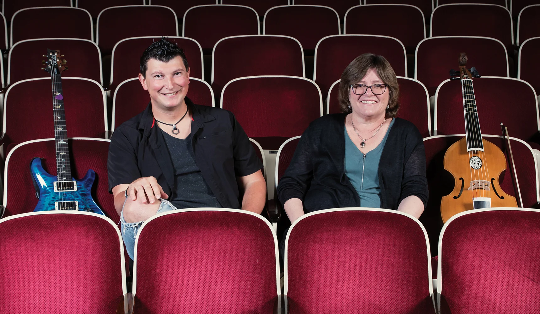 Konstantin Batygin and Lucy Jones share notes in Beckman Auditorium.