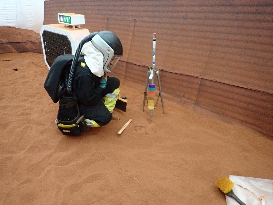  A CHAPEA mission 1 crew member completes a simulated extravehicular activity. 