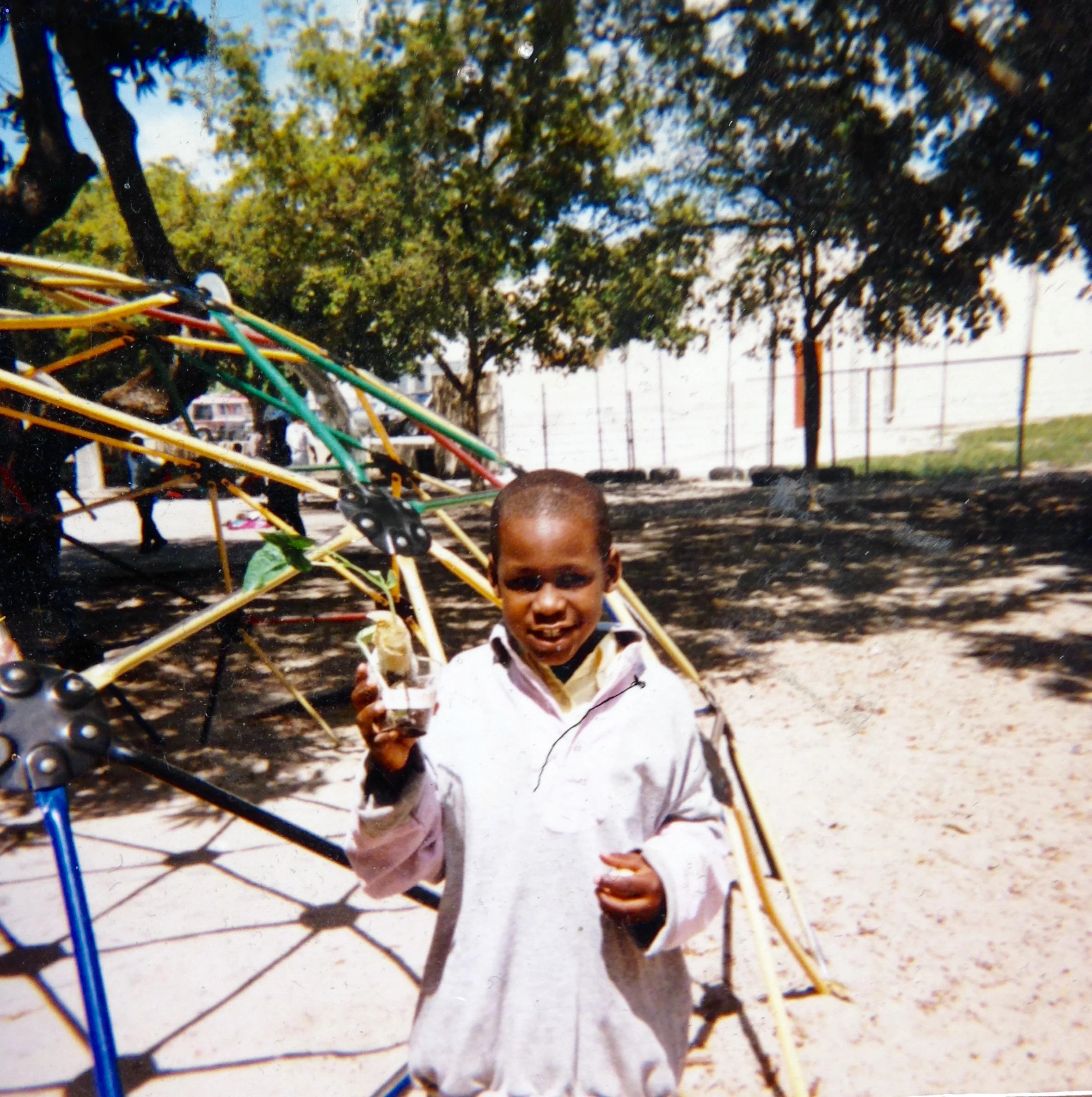 My brother outside Toussaint L’Ouverture Elementary School in Miami, Florida during the late 1990s.