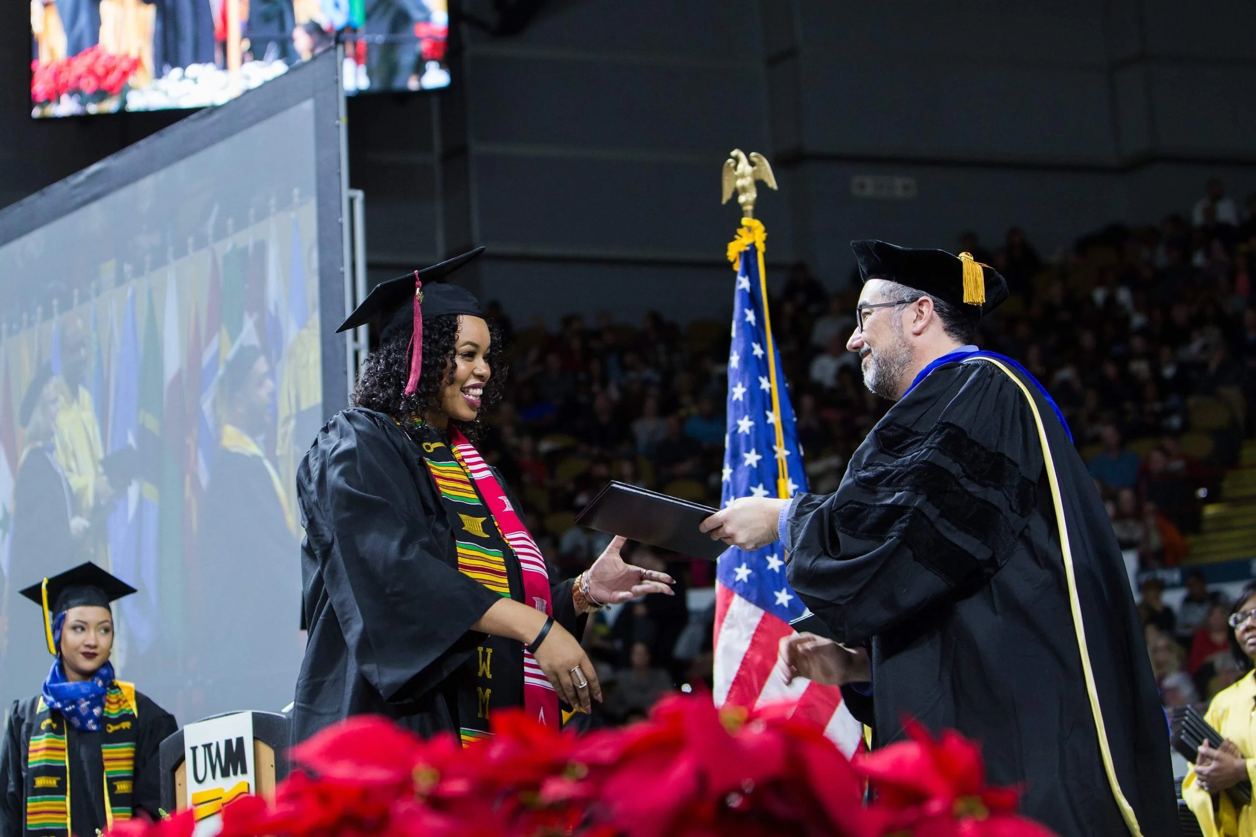 Miela Fetaw accepting her degree from the University of Wisconsin-Milwaukee. (Picture by Elora Hennessey)