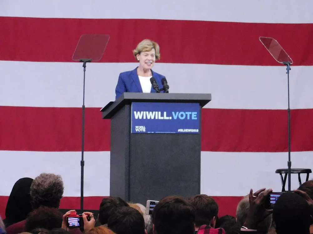 Tammy Baldwin shared her childhood story about struggling to get healthcare with the crowd. (Picture by Nyesha Stone)