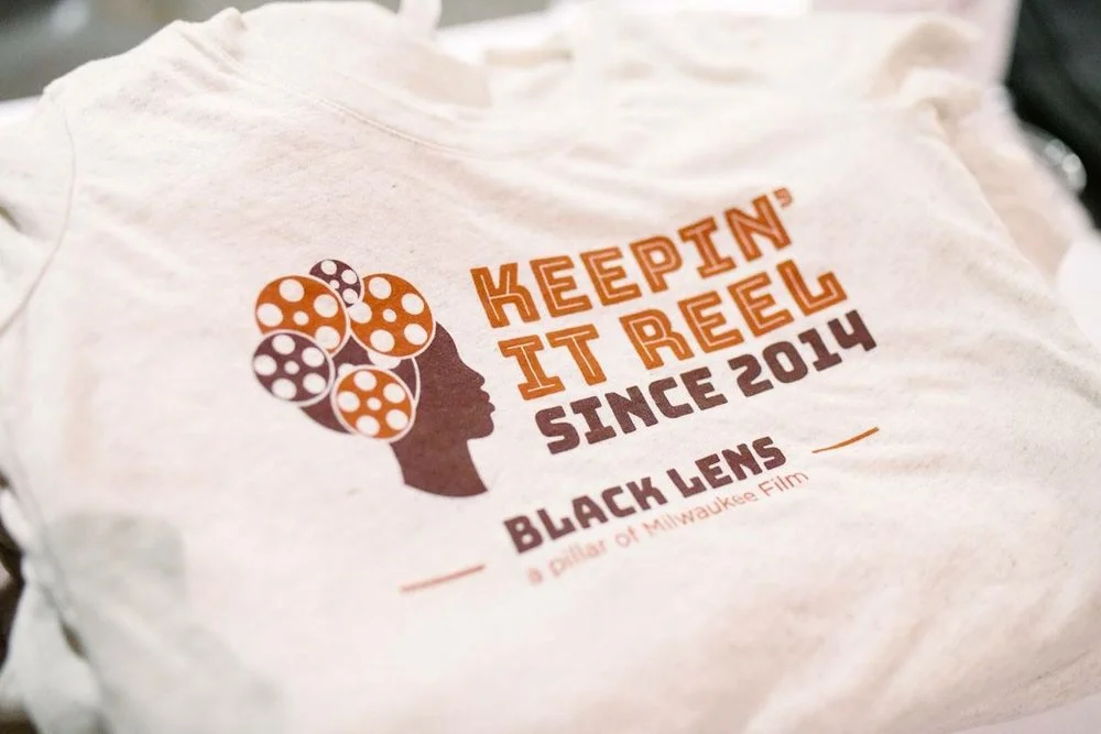 Black Lens MKE merchandise. (Picture taken by Jake Hill for Milwaukee Film Festival)