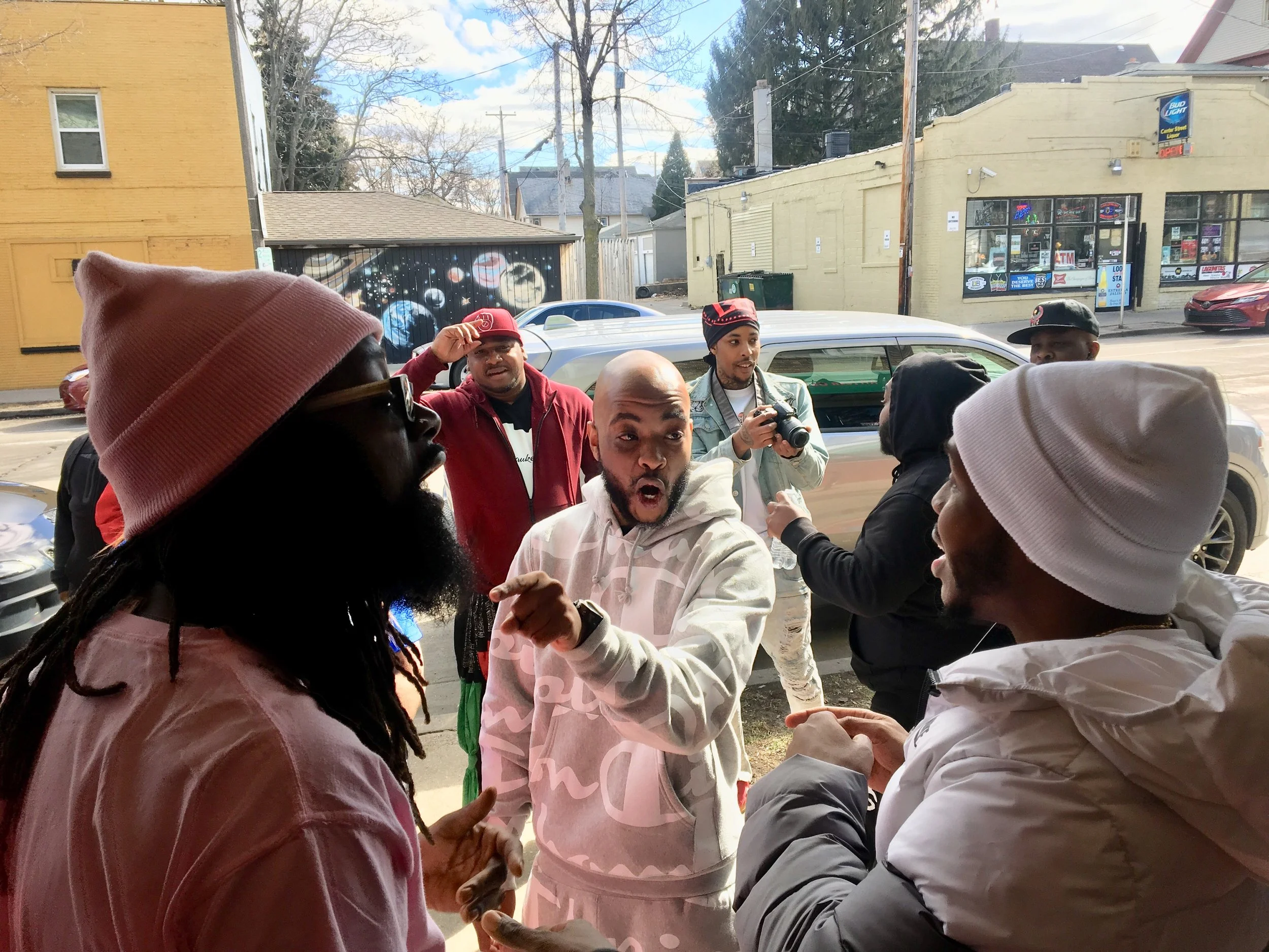 Rap battlers are some of the most passionate fans and harshest critics. Buck, Larry Bull and Merc go at it outside during a Cartel event. (Photo by Gab Taylor)