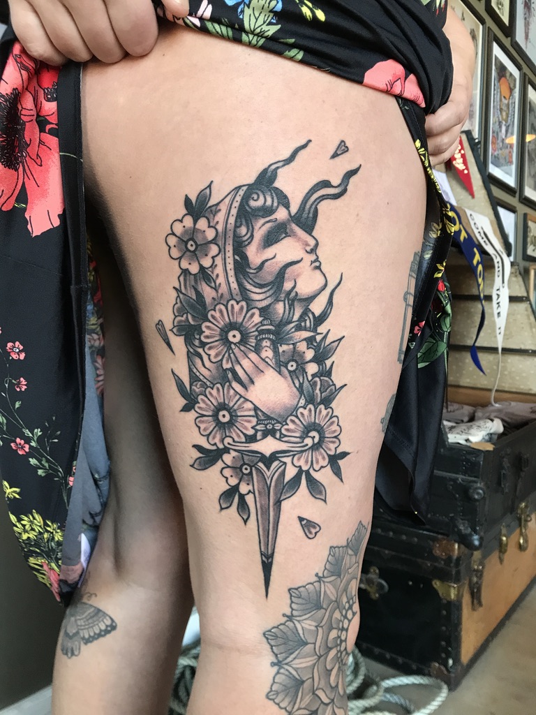 woman and dagger tattoo