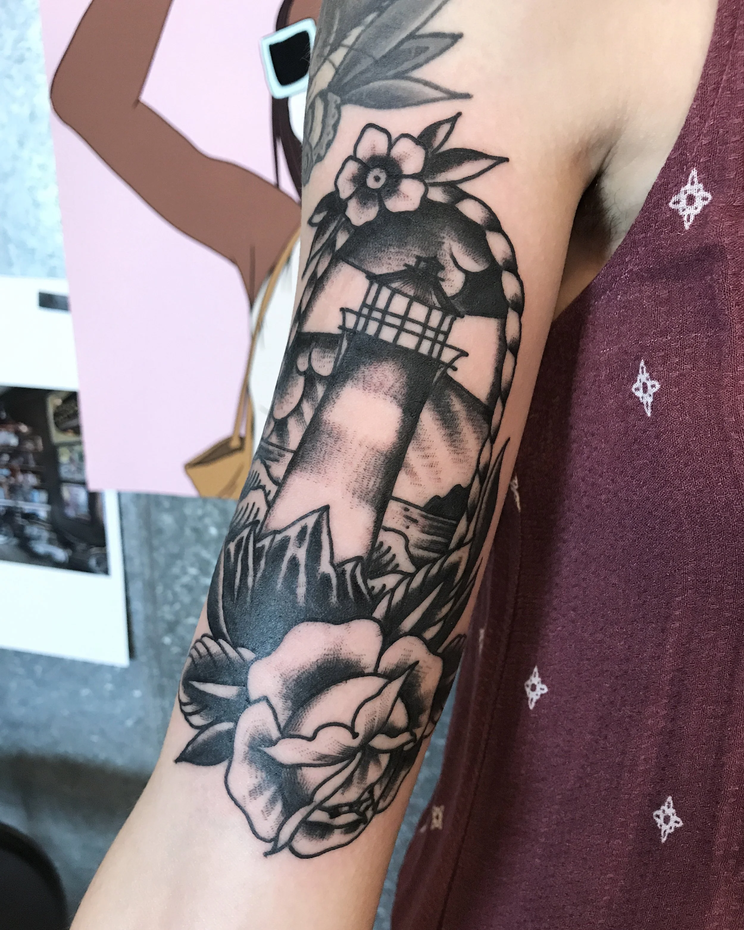 Traditional lighthouse arm tattoo