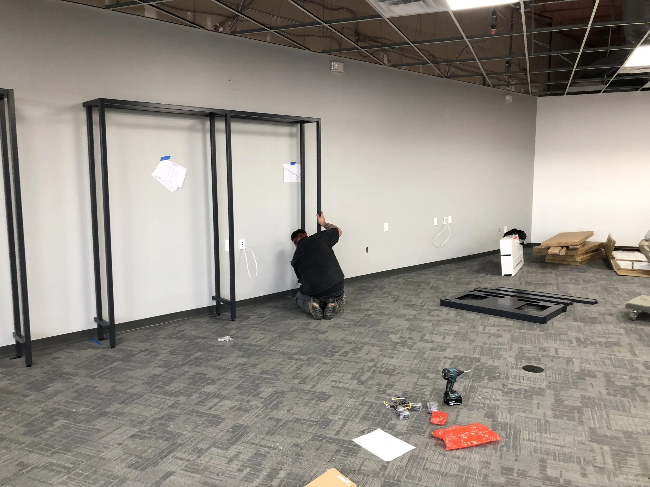 installing fixtures in Verizon store
