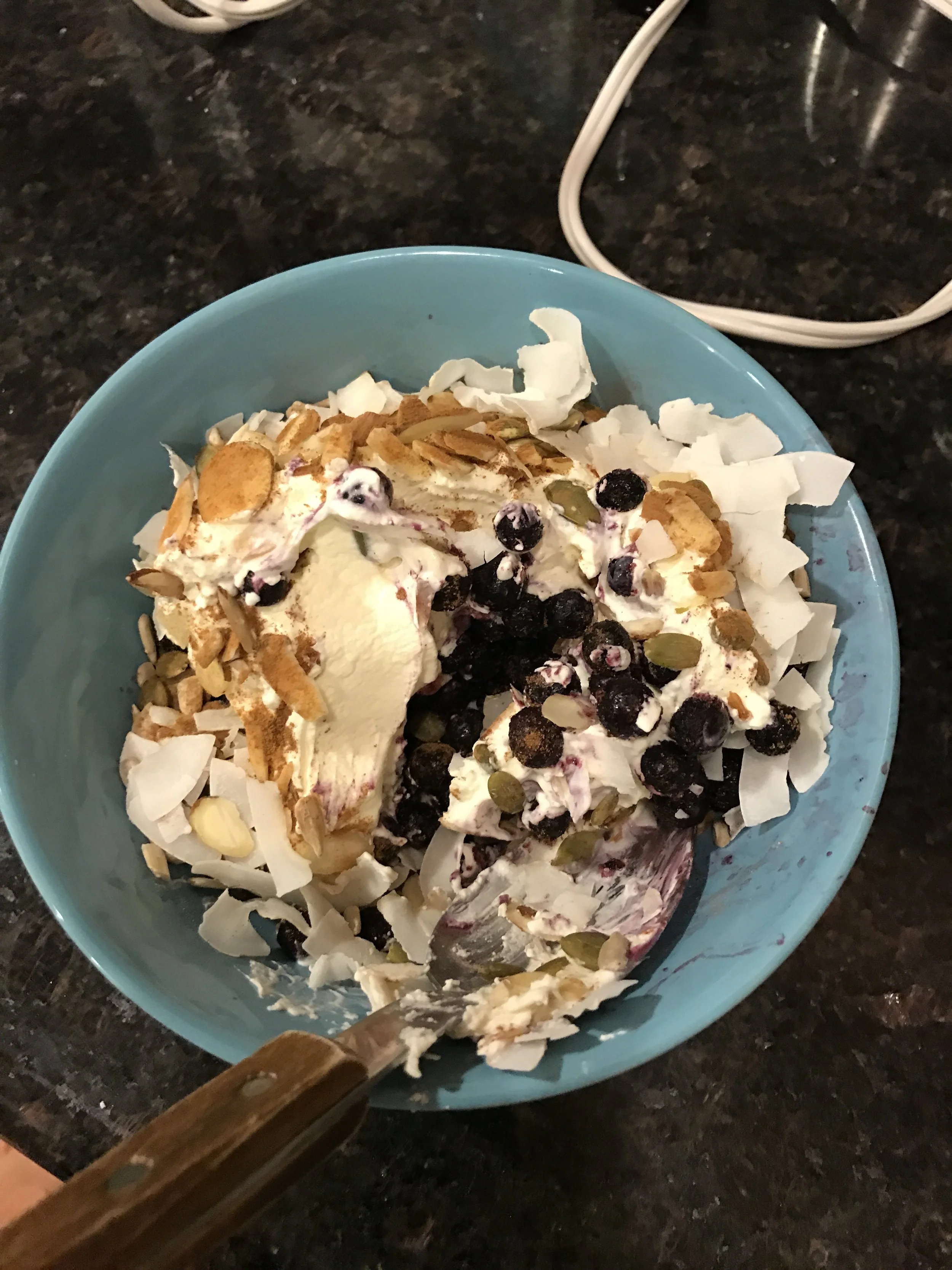Sugar free vanilla whipped cream, wild blue-berries, nuts, seeds, coconut flakes and cinnamon