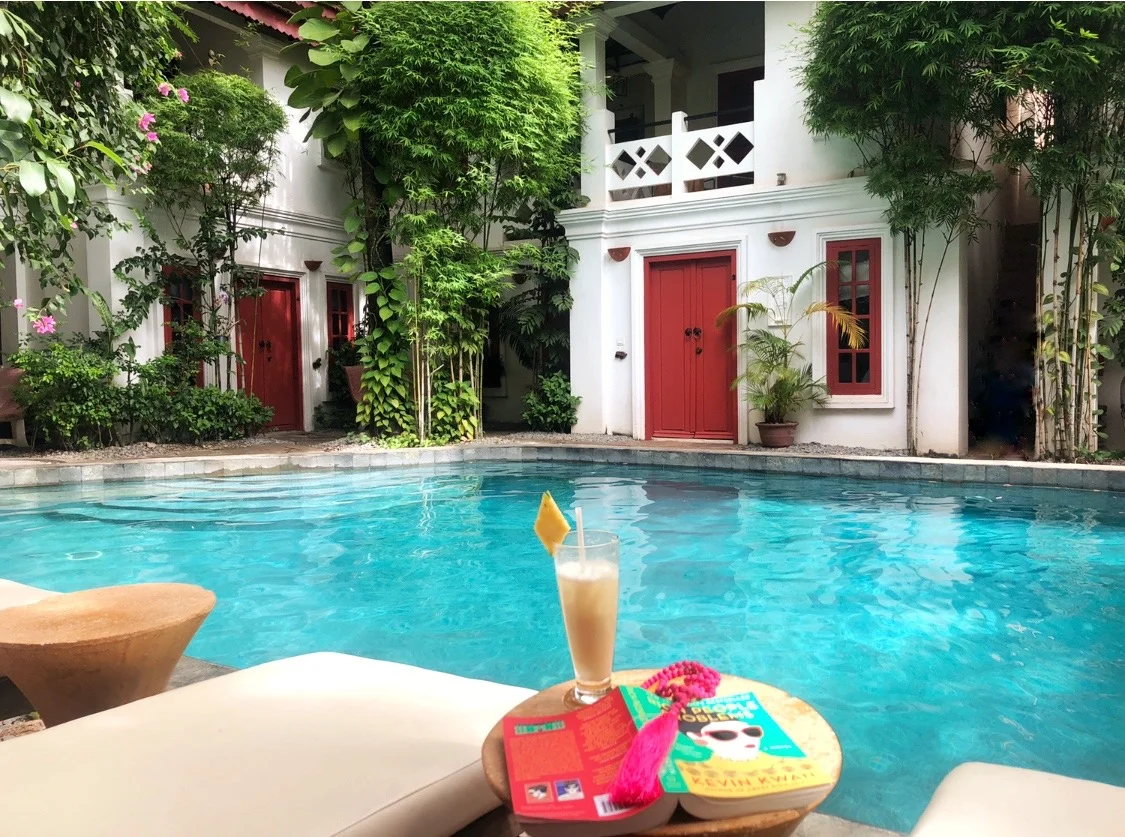 rambutan_hotel_pool_book.jpg