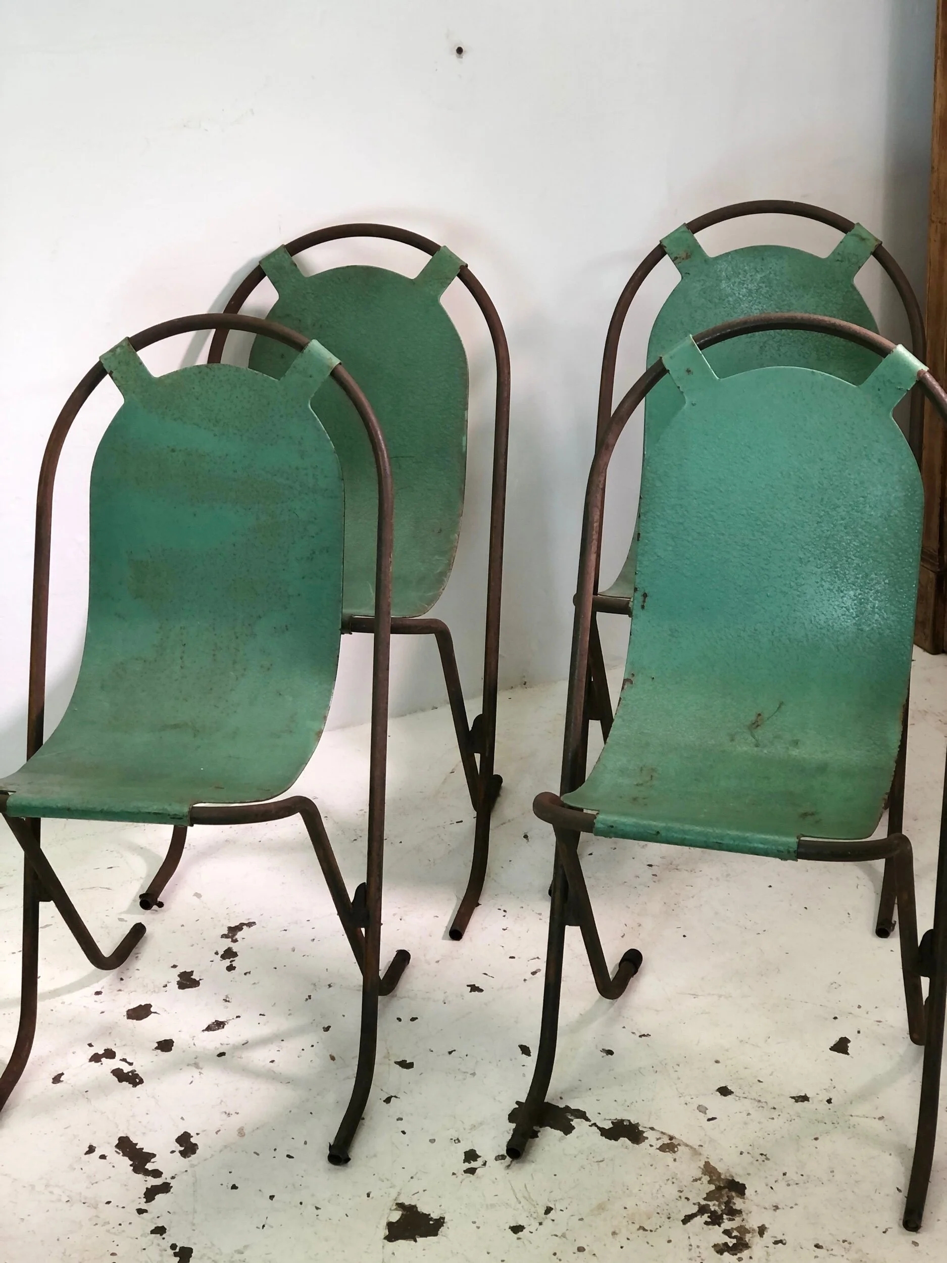 set of four stak a bye chairs