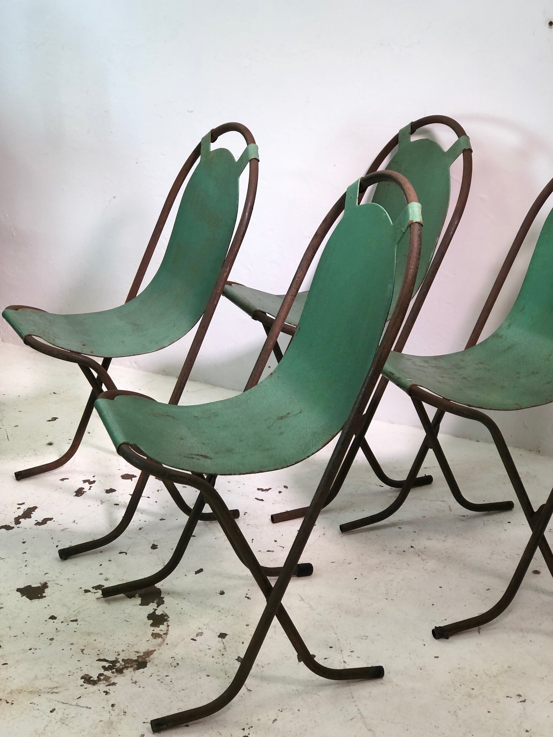 set of four stak a bye chairs