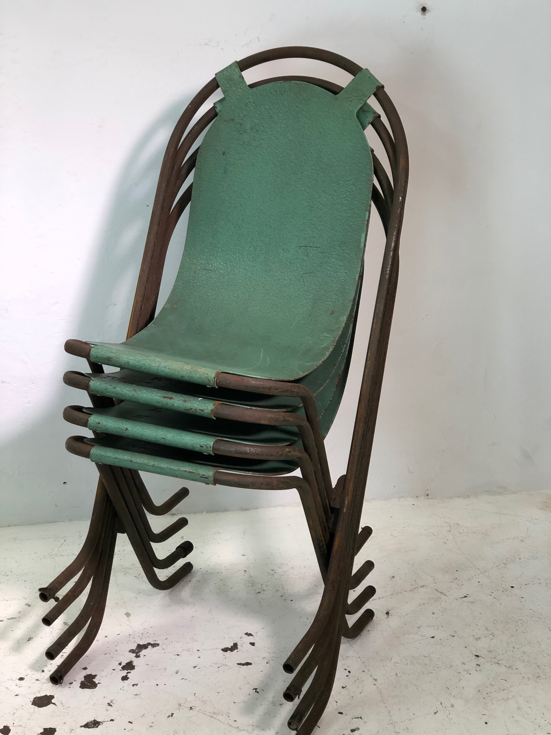 set of four stak a bye chairs