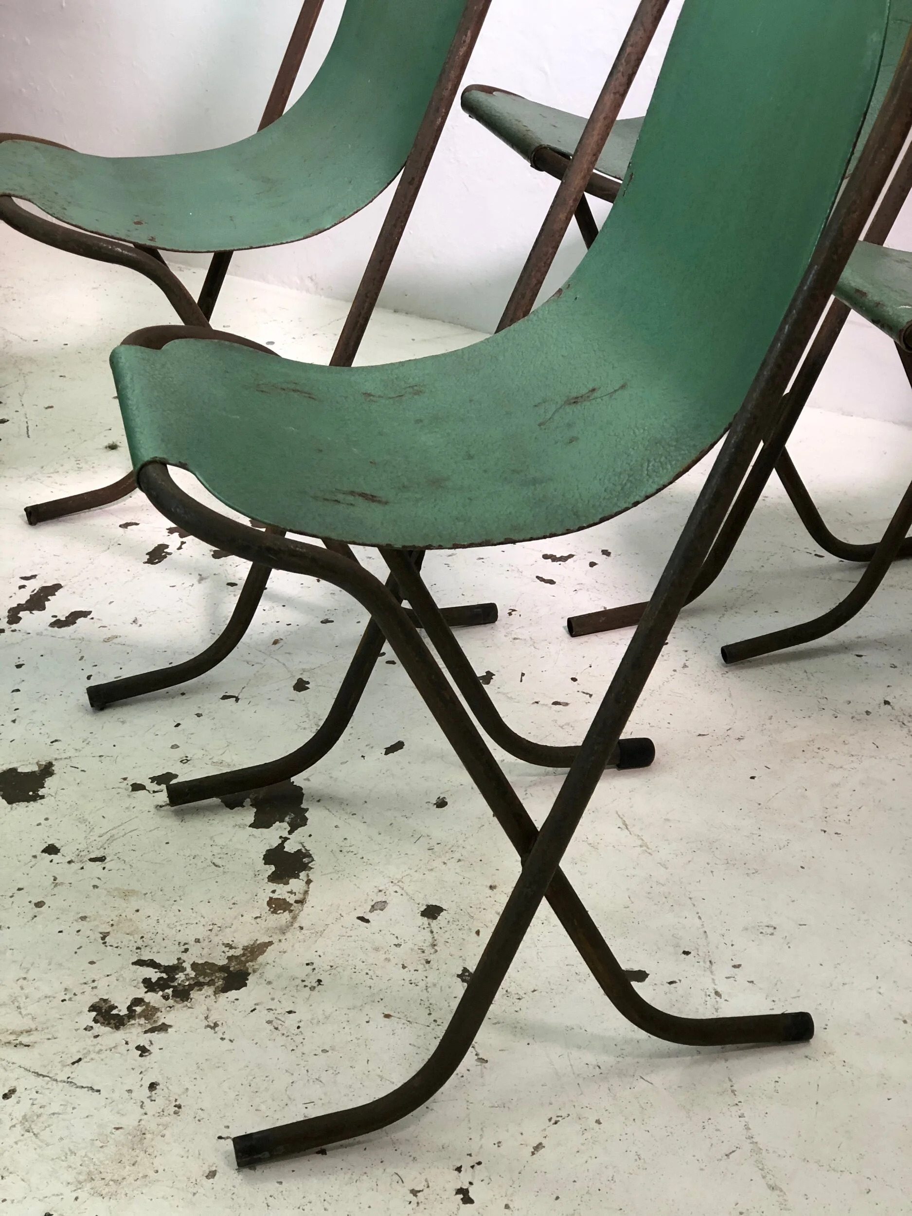 set of four stak a bye chairs