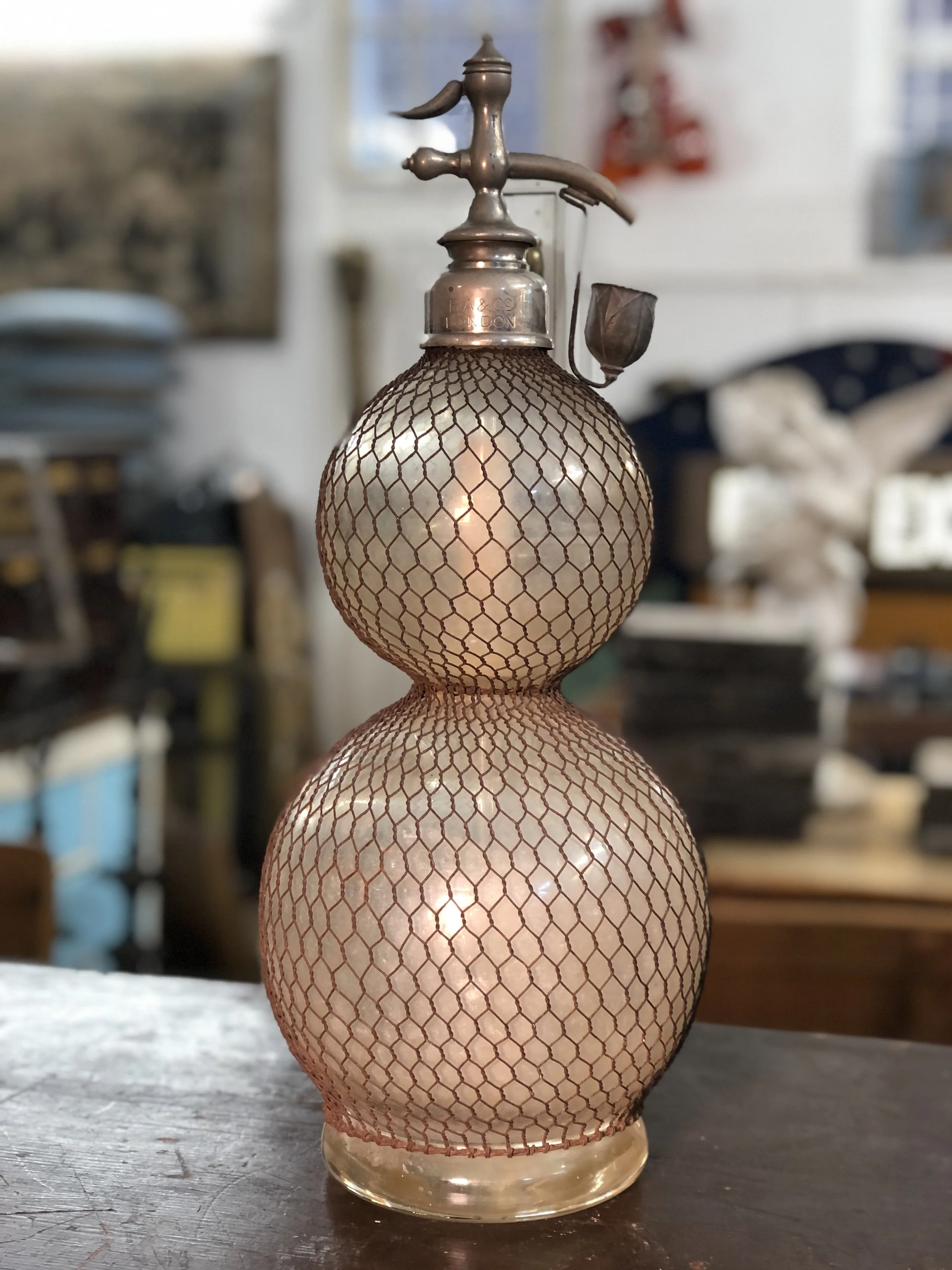 large antique seltzer bottle