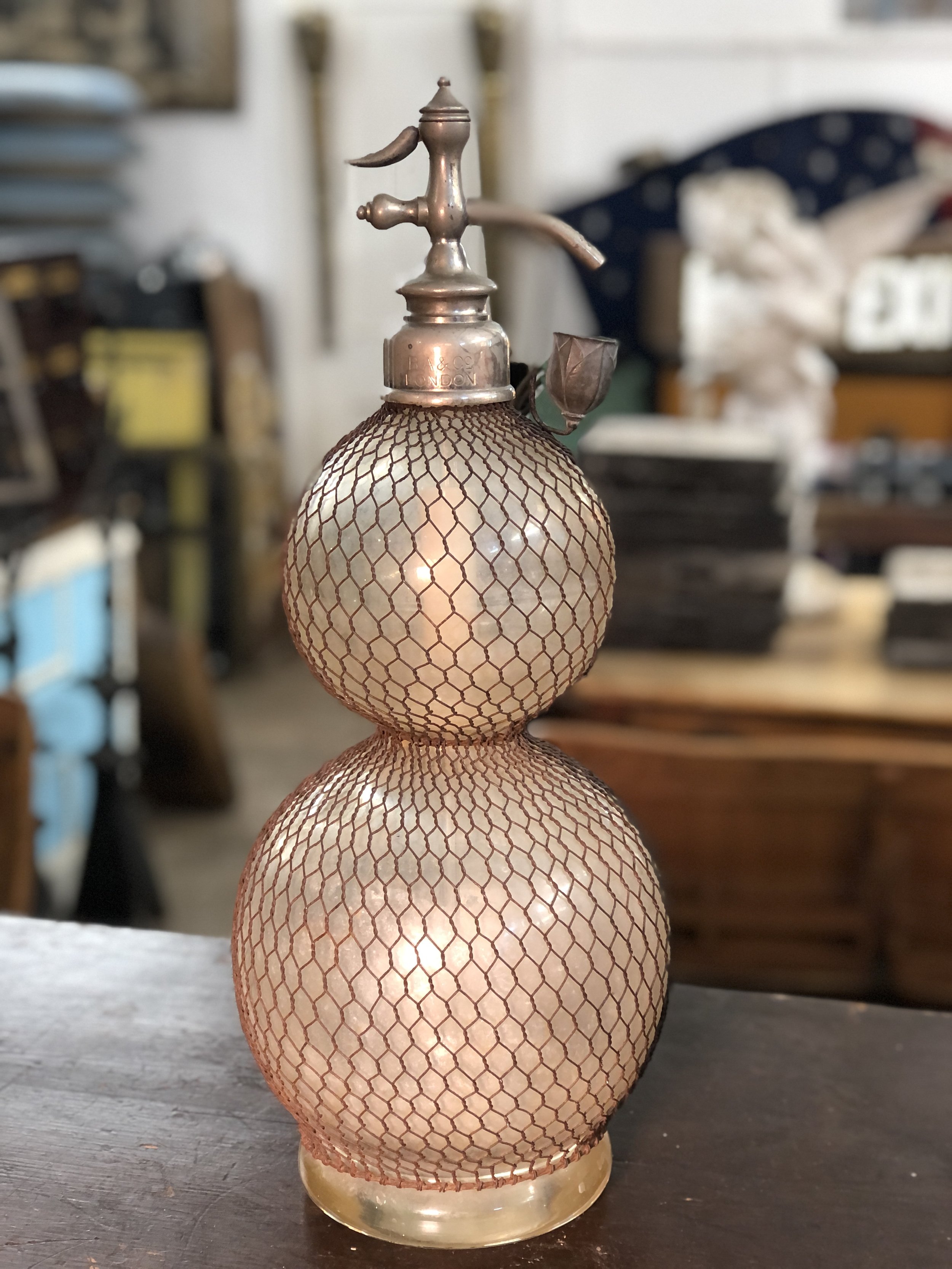 large antique seltzer bottle