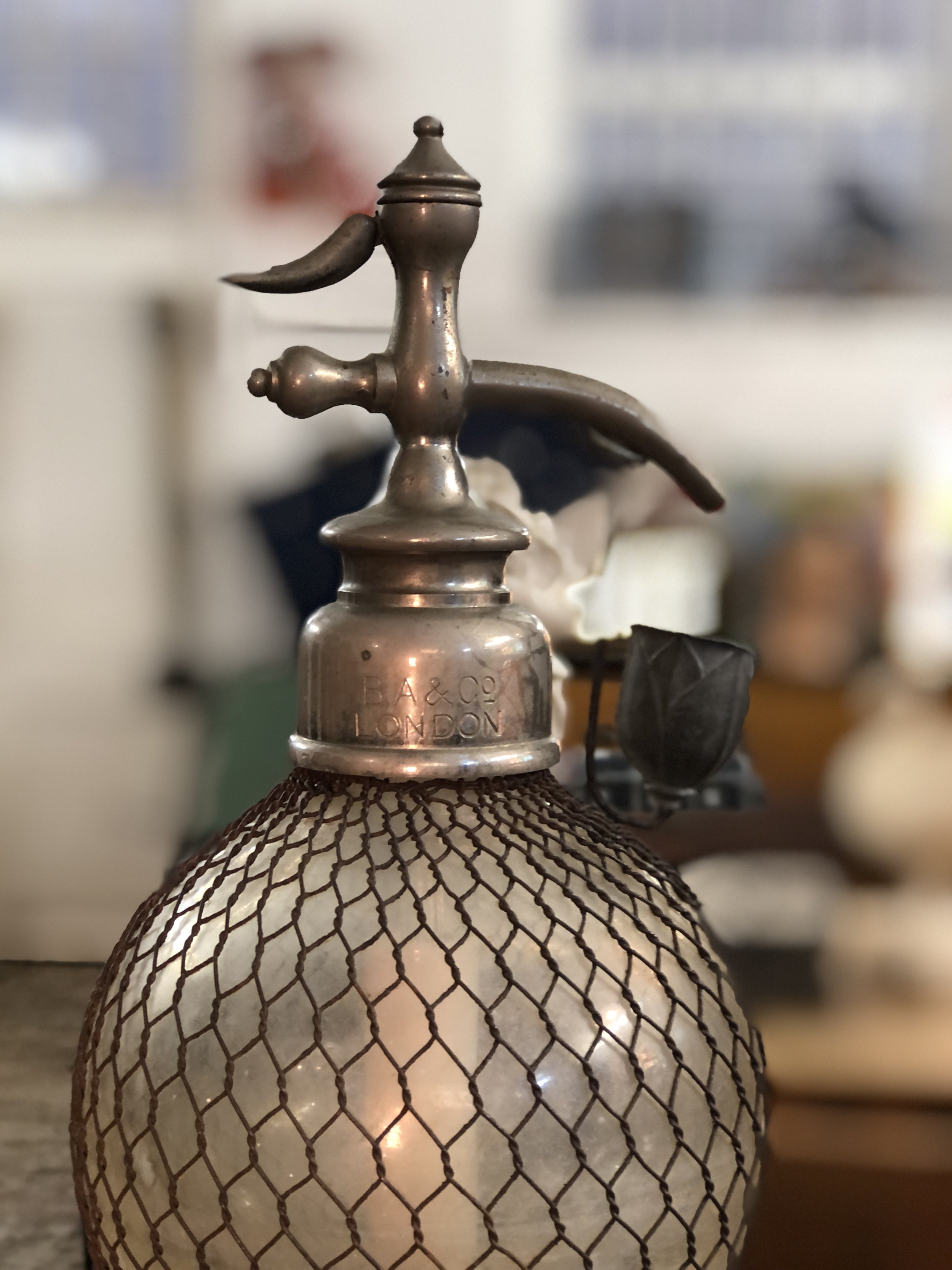 large antique seltzer bottle
