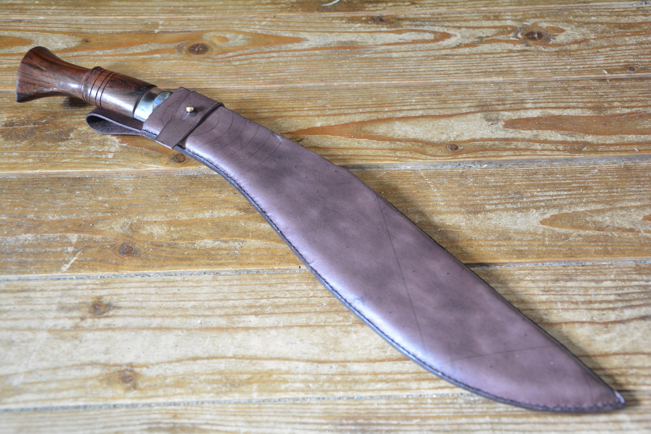 Kukri with open back scabbard, bet loop and stud