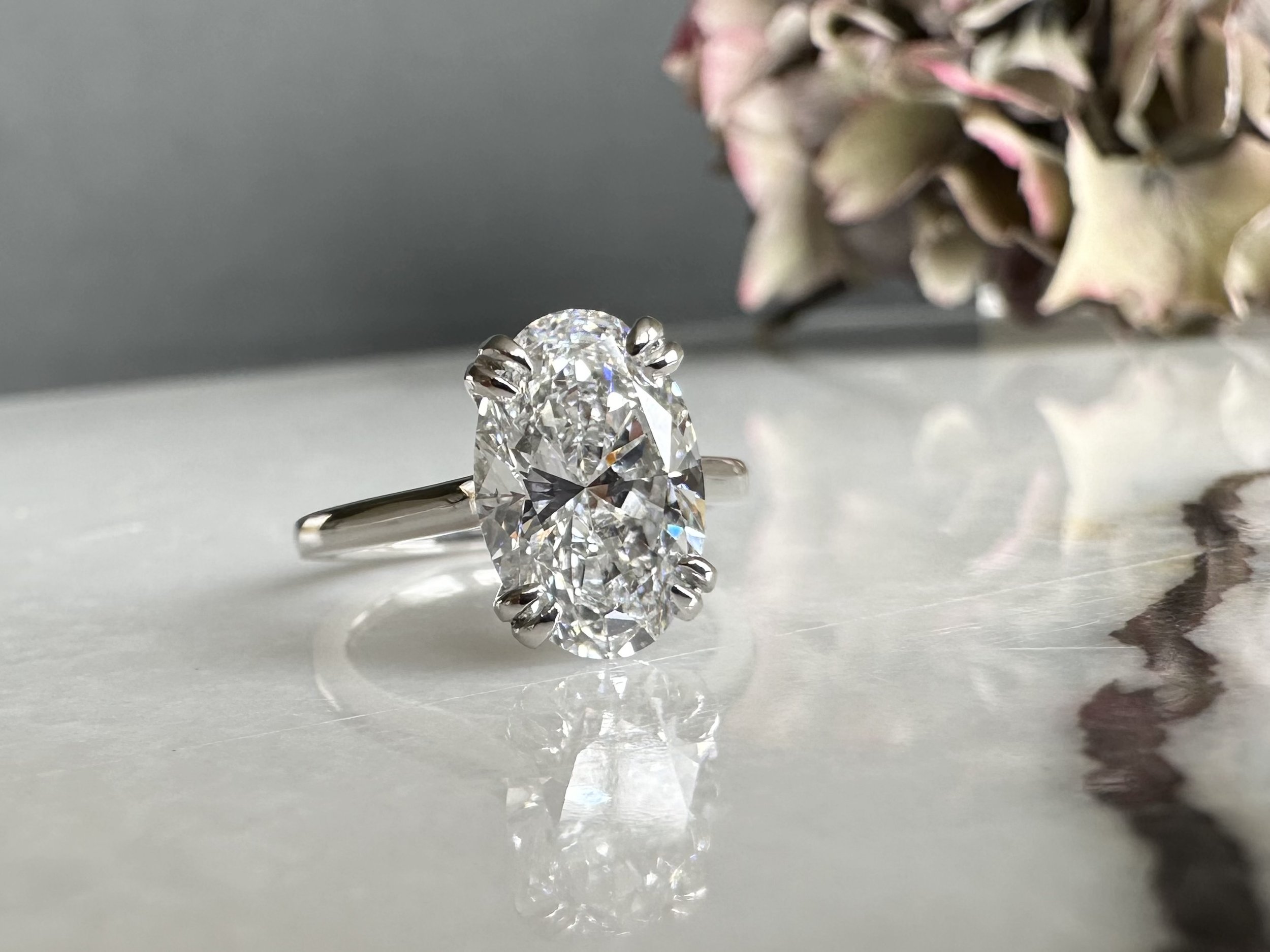 Bespoke oval diamond ring by Christopher Stoner