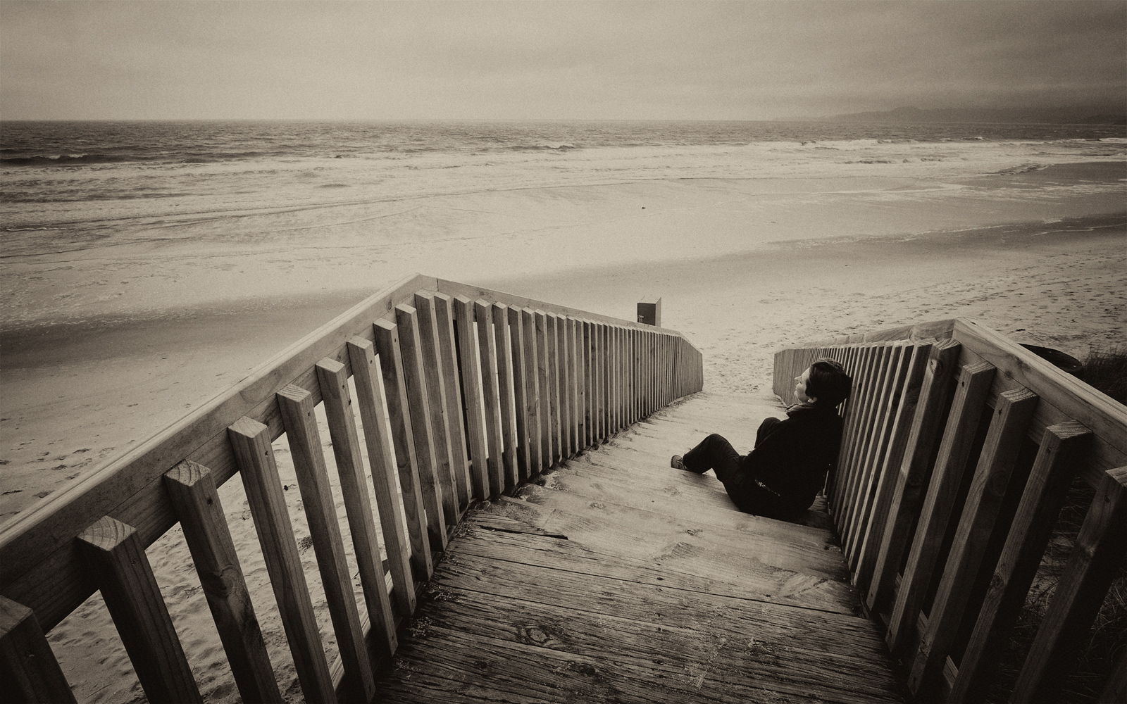 Contemplating a deserted New Zealand beach