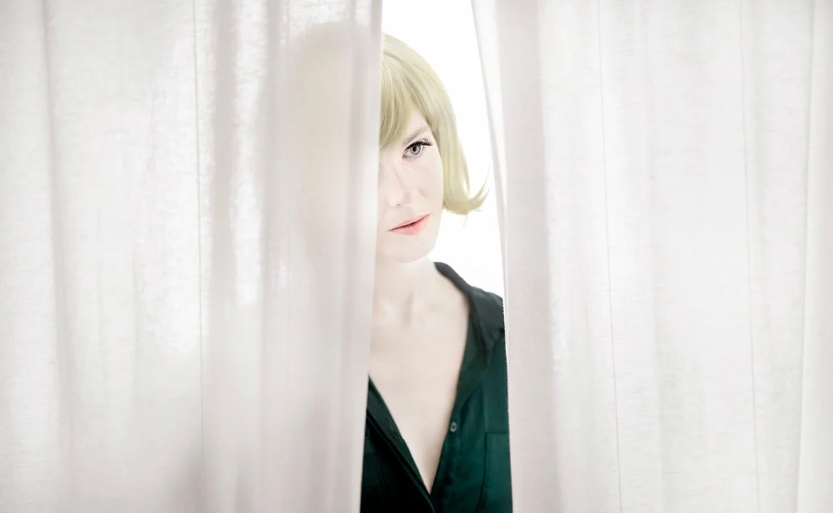 The Doll Behind the Curtain